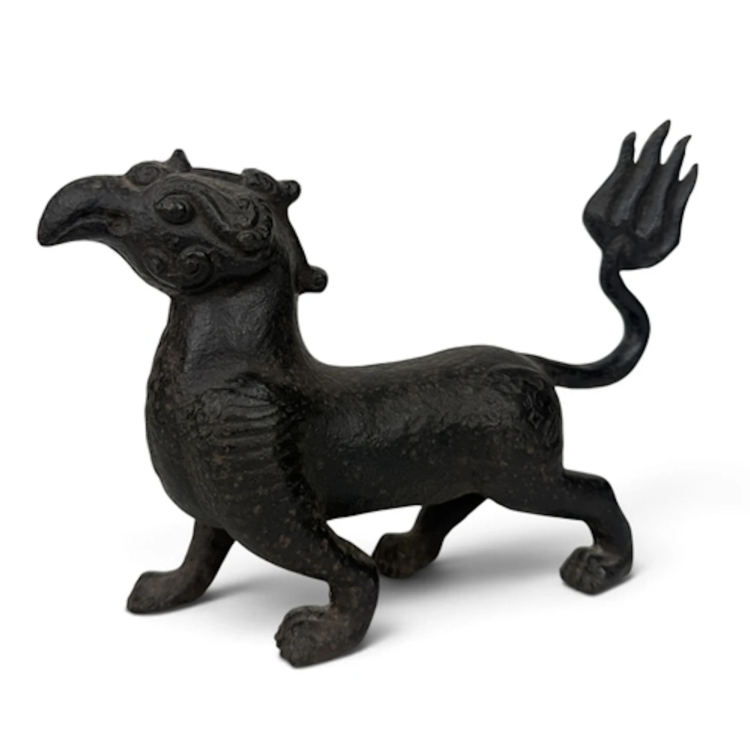 A CHINESE IRON MYTHICAL CREATURE 22cm x 17cm