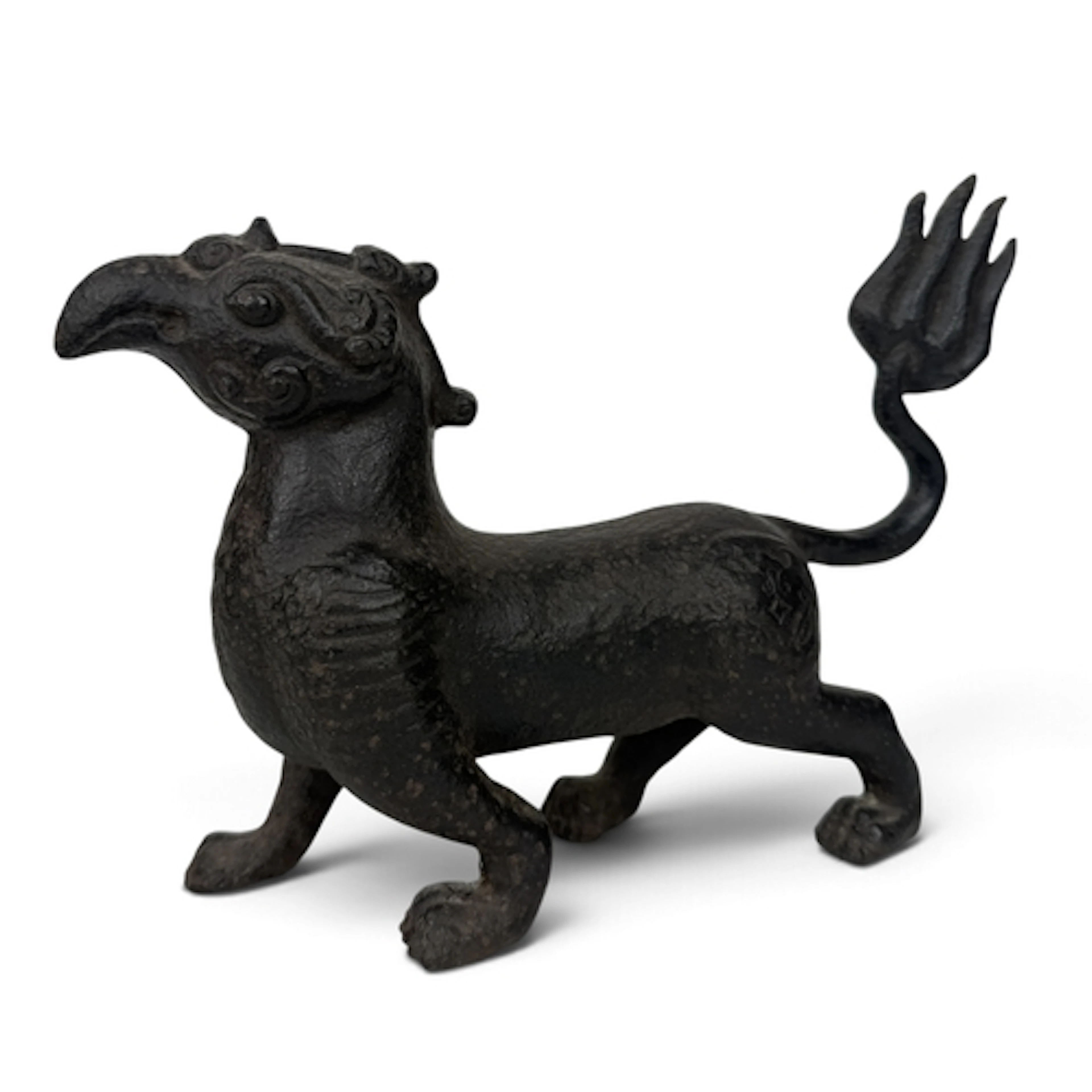 A CHINESE IRON MYTHICAL CREATURE 22cm x 17cm