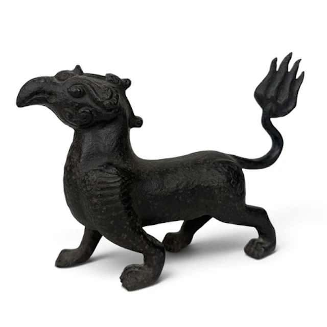 A CHINESE IRON MYTHICAL CREATURE 22cm x 17cm