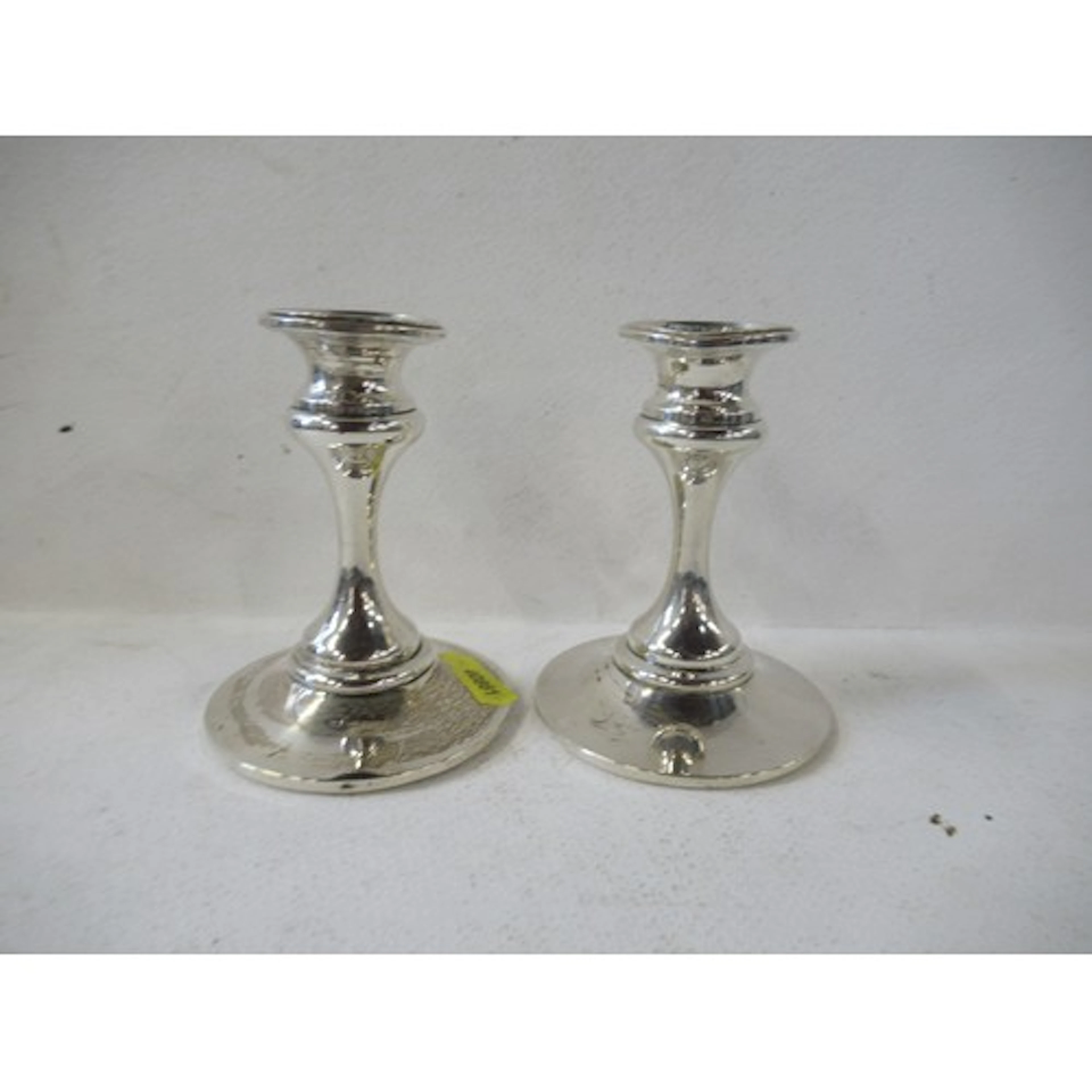 A pair of loaded silver dwarf candlesticks, height 4ins