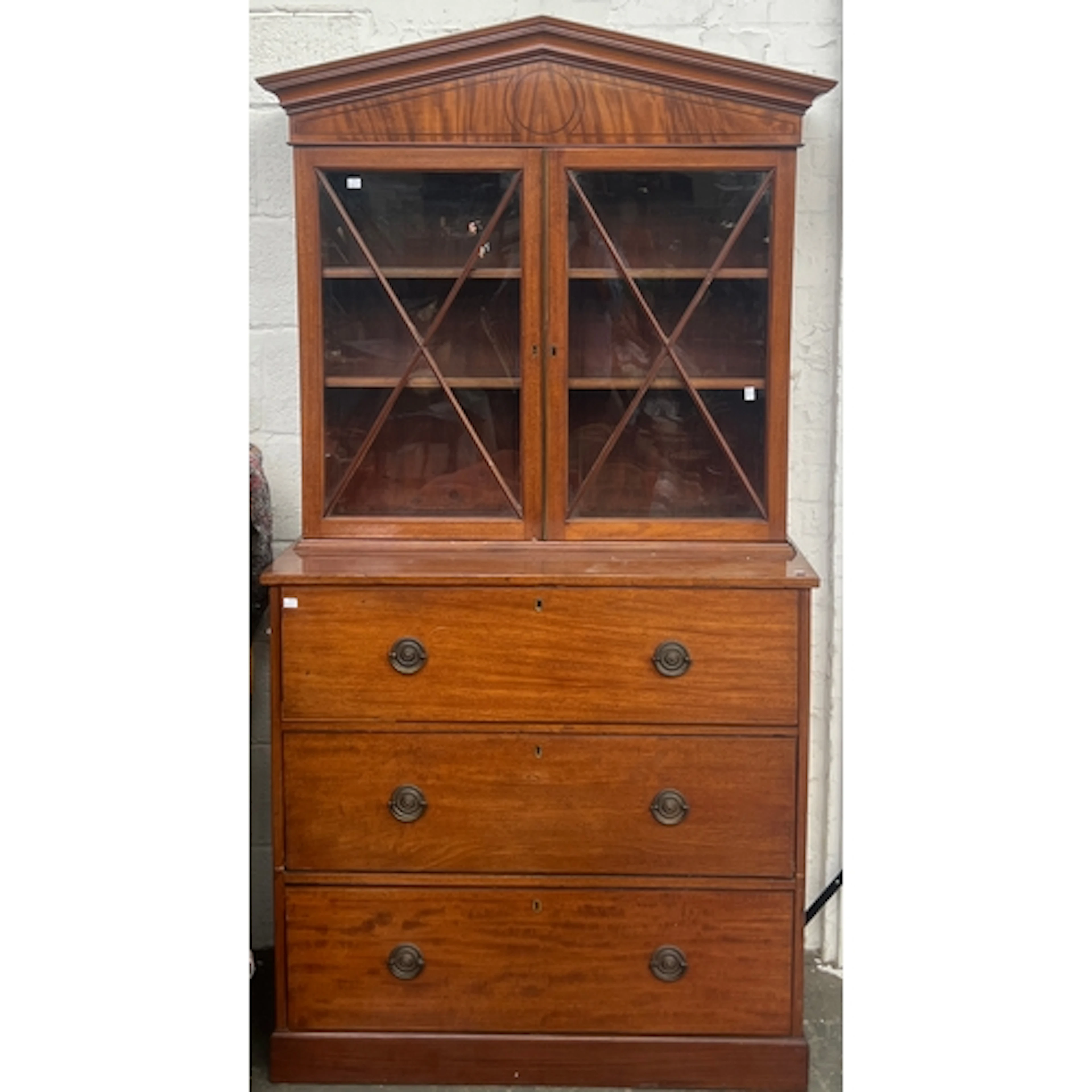 An astragal glazed secretaire bookcase, the moulded pediment...