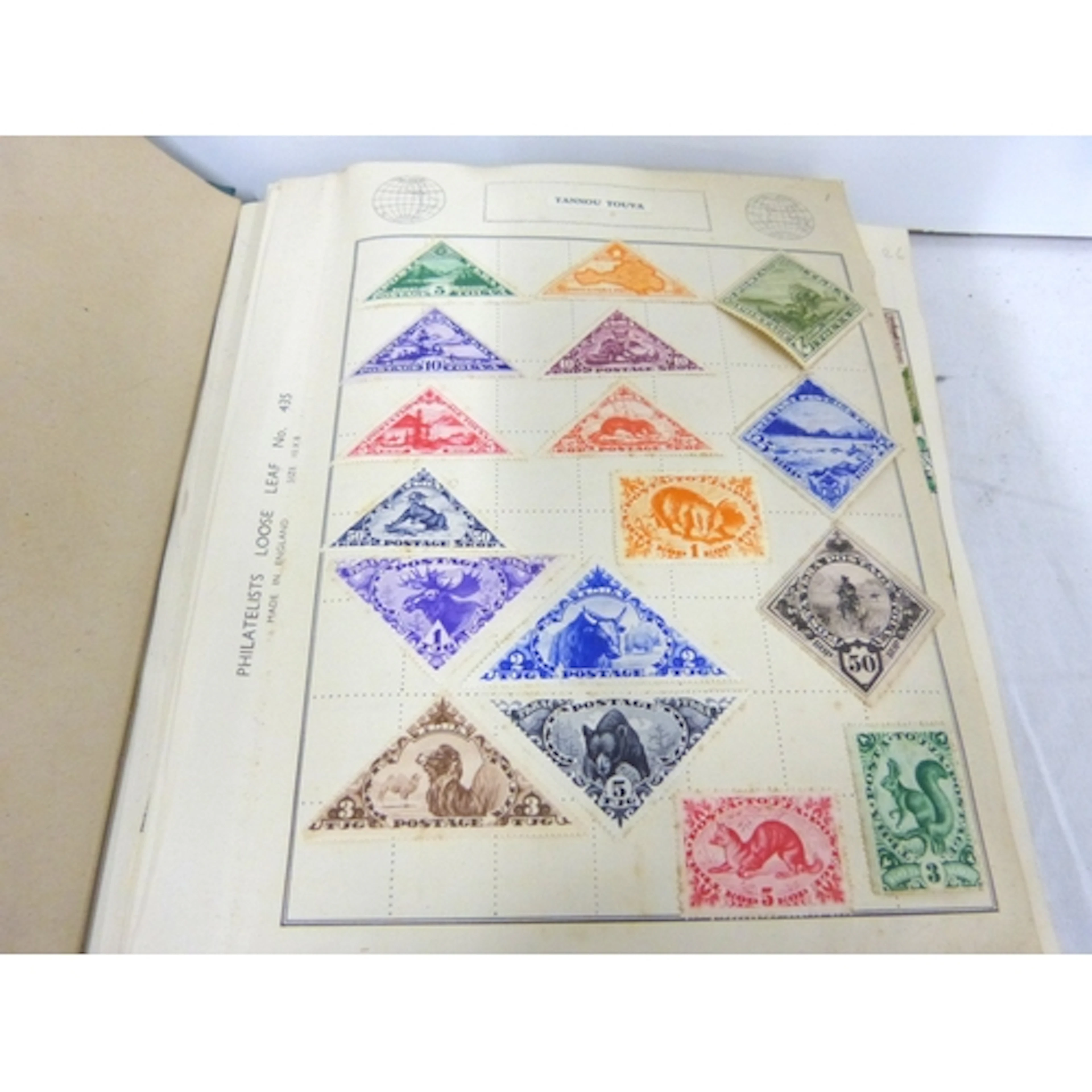 Large vintage stamp album to include Tannou Touva, Paraguay,...