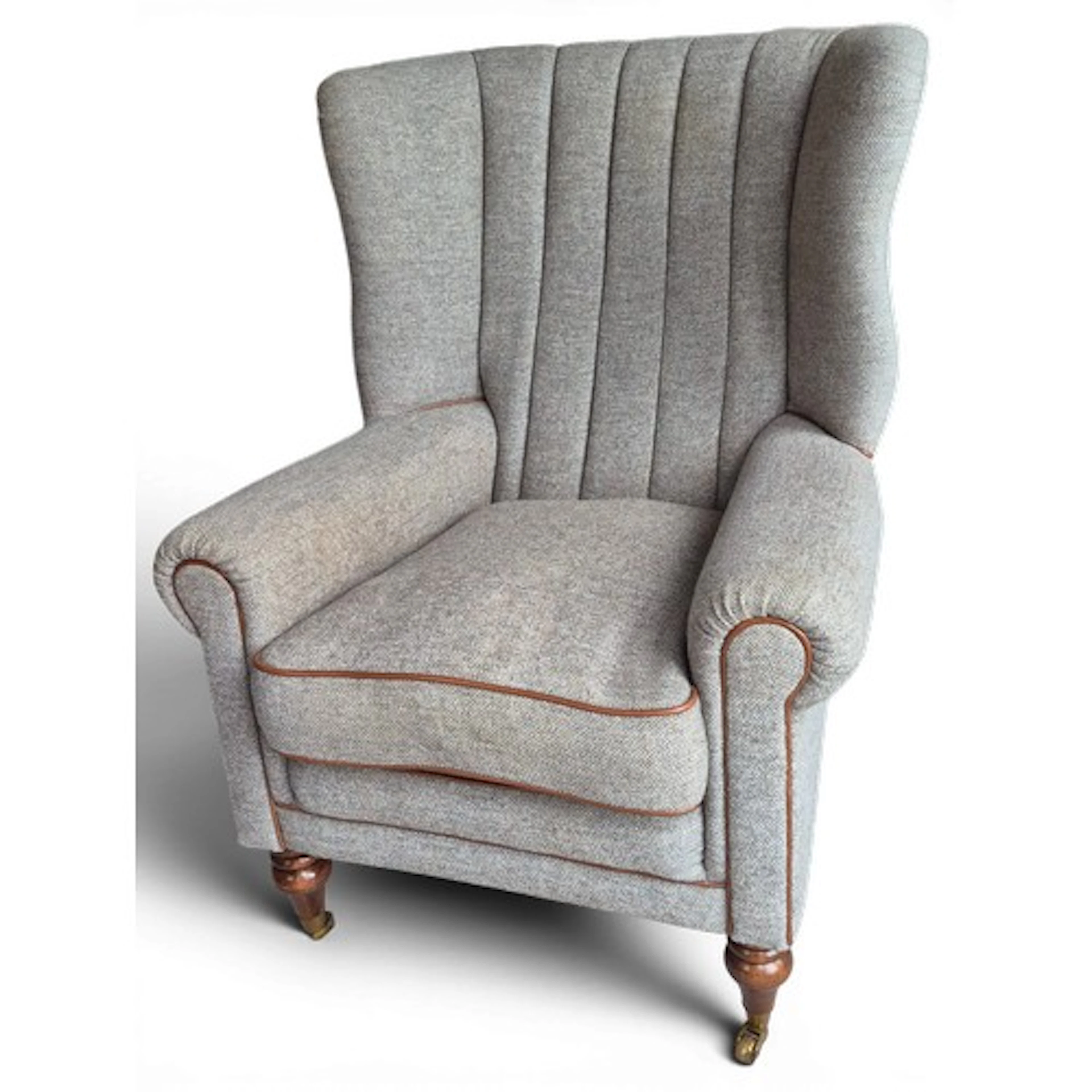 A Harris Tweed wingback armchair, upholstered in 'Heather' w...
