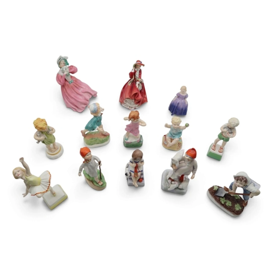 A group of Royal Worcester children figures including Tuesda...