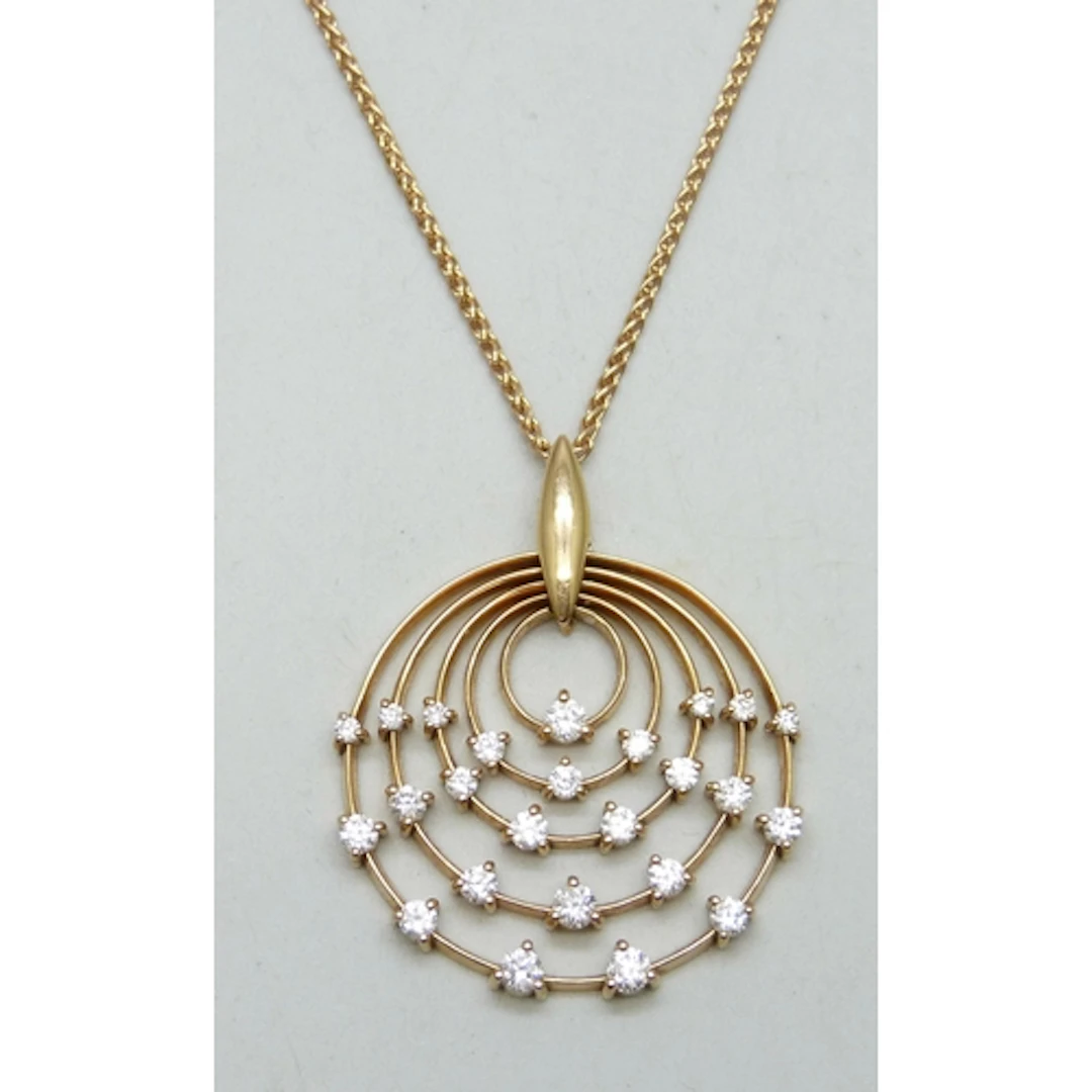 An 18ct rose gold diamond set pendant on a matching 18ct ros...