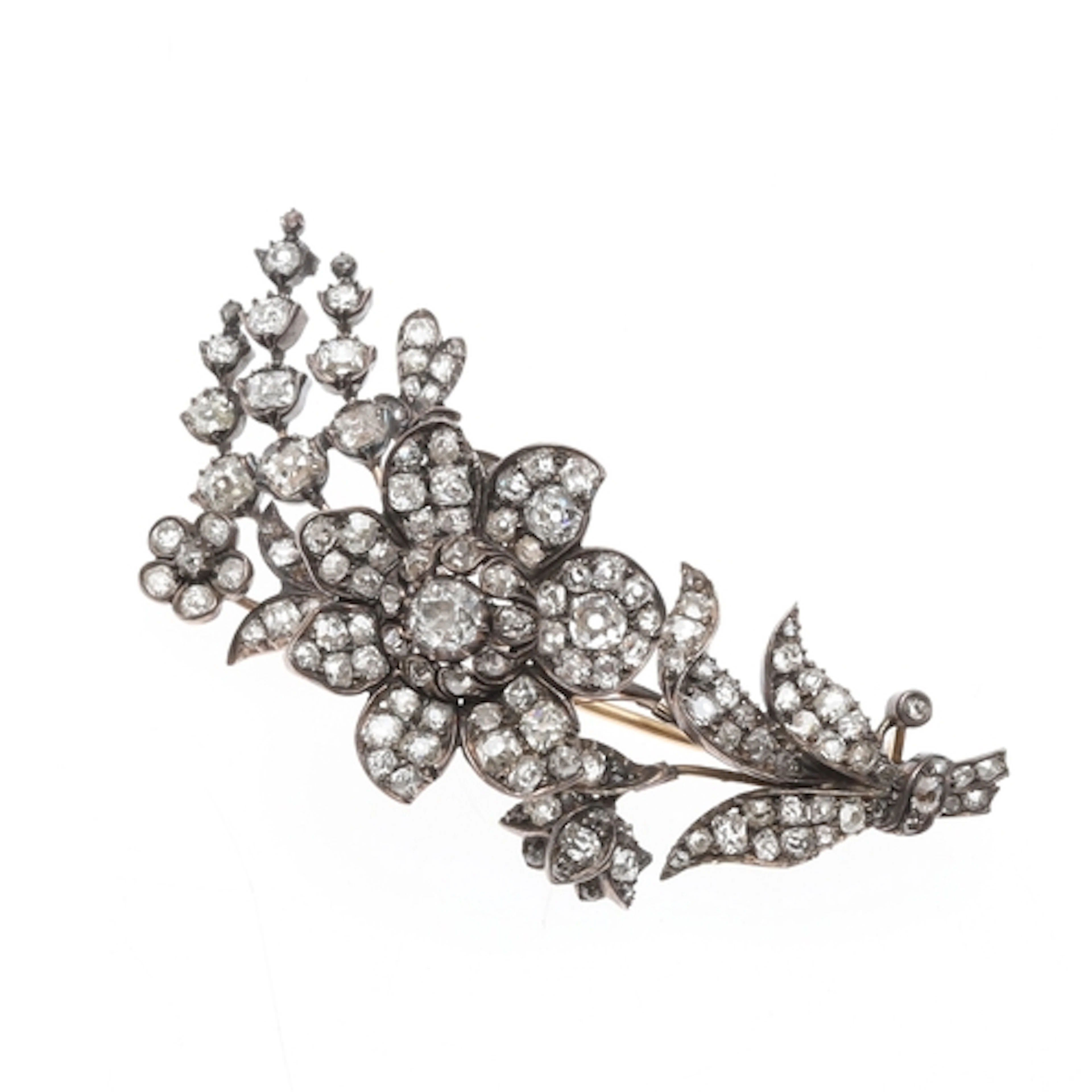 A VICTORIAN DIAMOND FOLIATE BROOCH. the central flowerhead s...