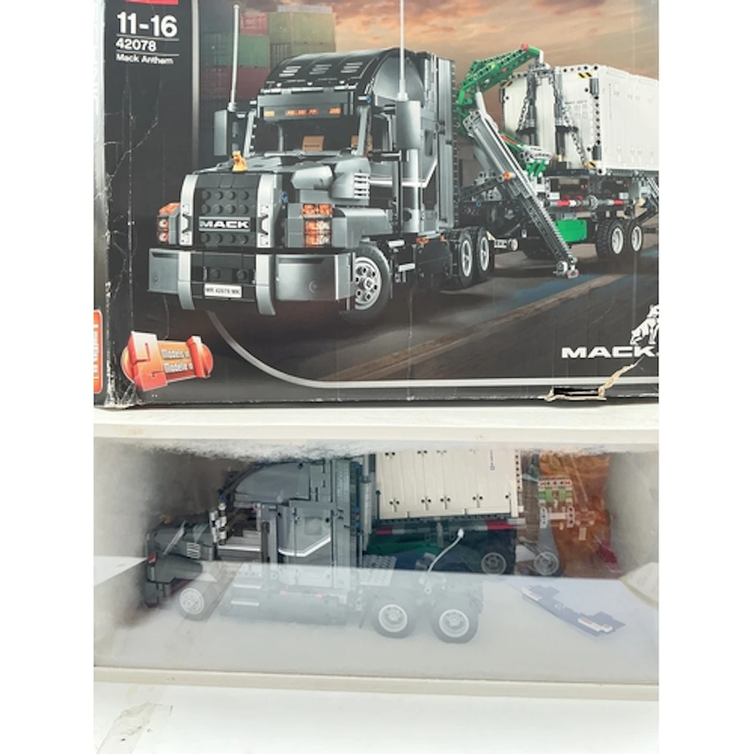 A Lego Technic Mack Anthem Truck, In Display Case, With Box....