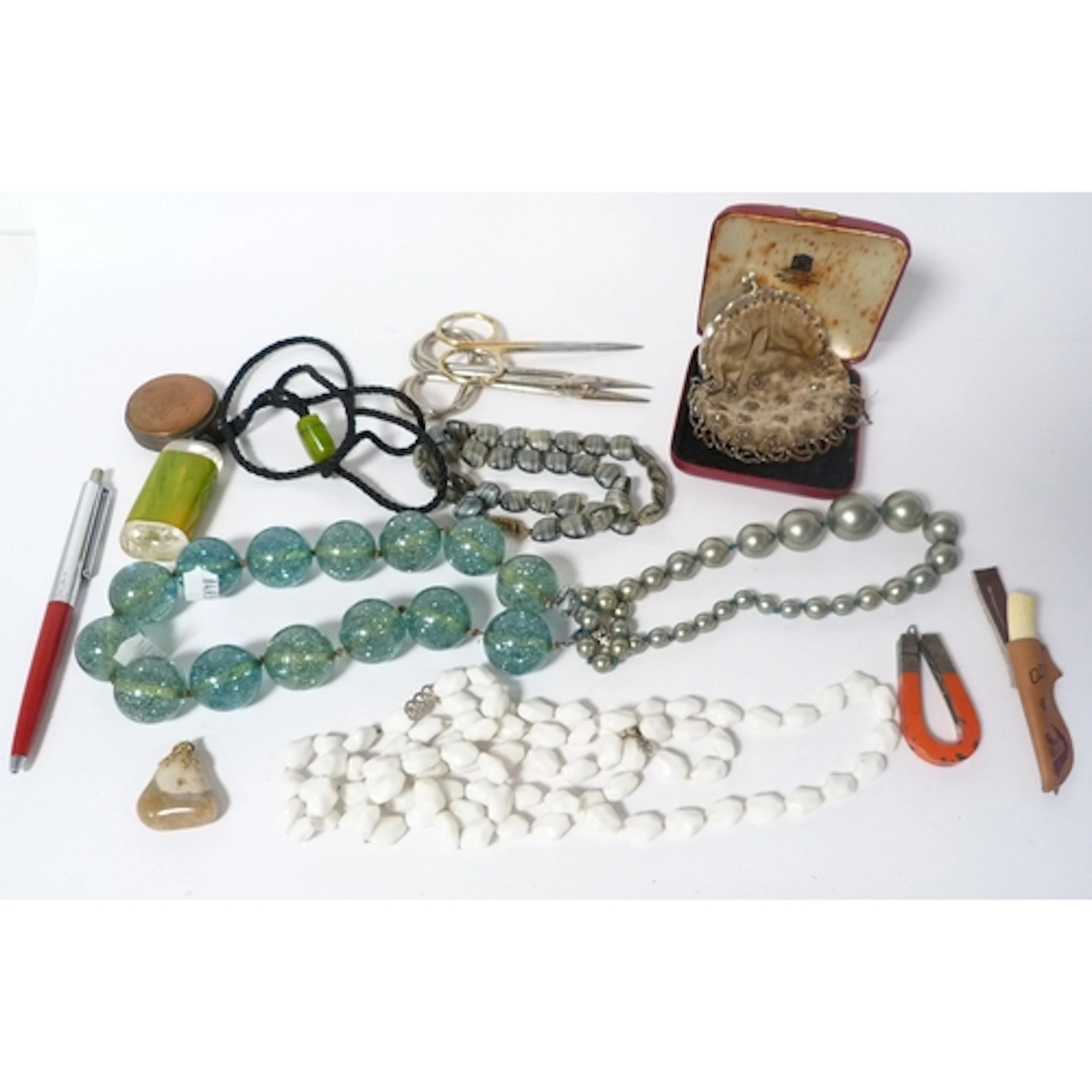 Group of necklaces to include a carved agate example, milk g...
