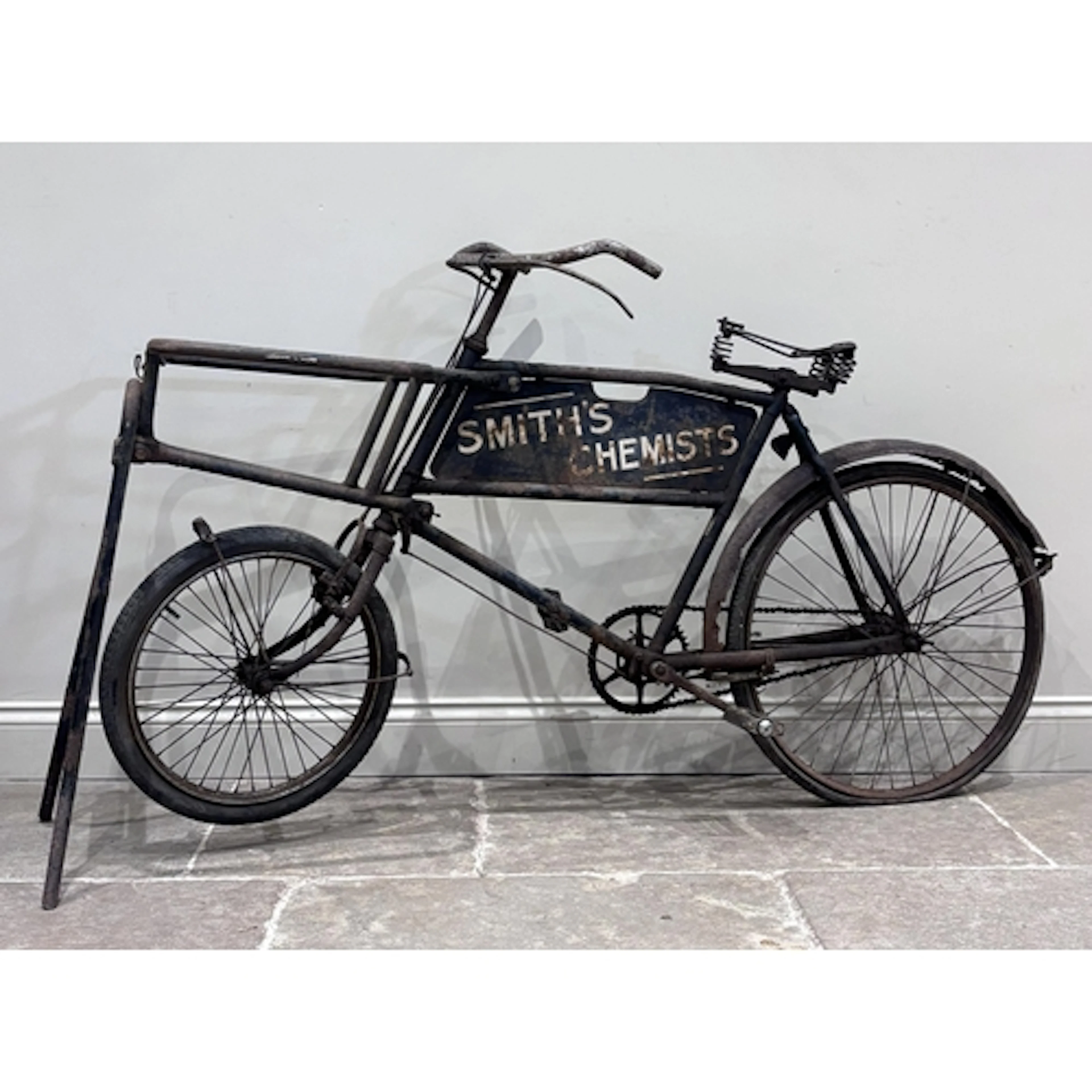 A vintage 'Smiths Chemists' advertising delivery bicycle, ea...