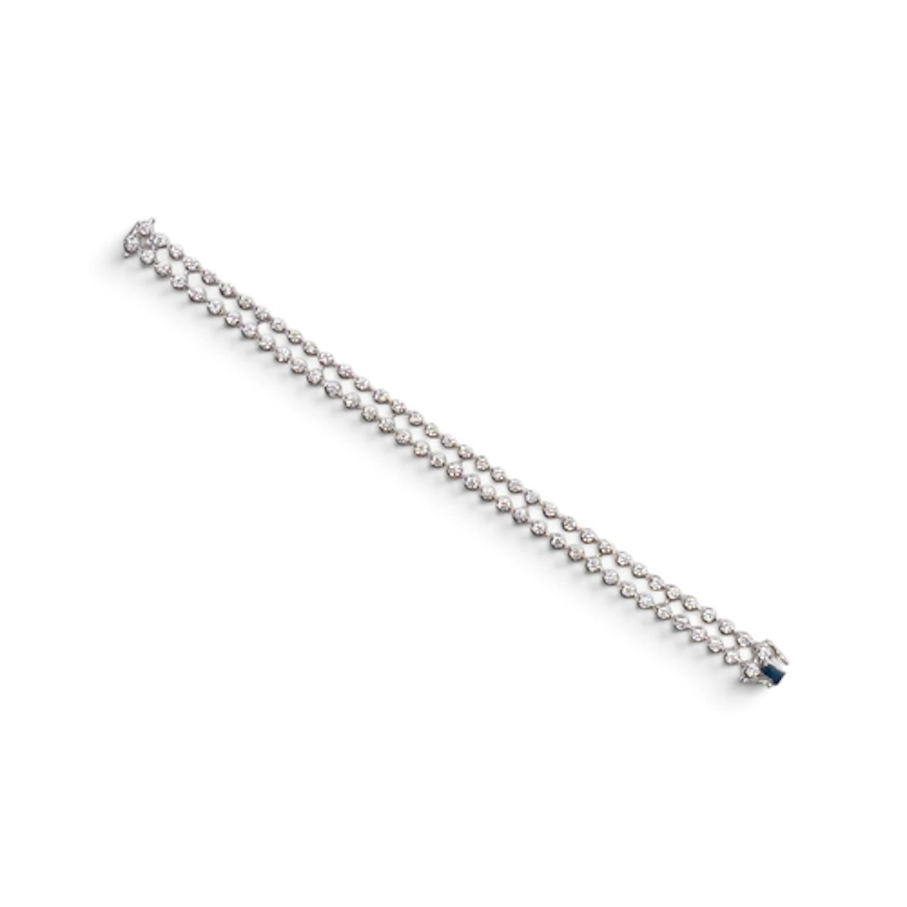 A DOUBLE ROW DIAMOND TENNIS BRACELET. in 18ct white gold set...