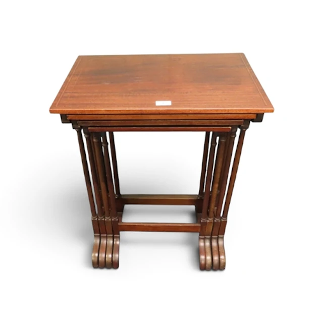 A 20th century Regency style mahogany veneered nest of four ...