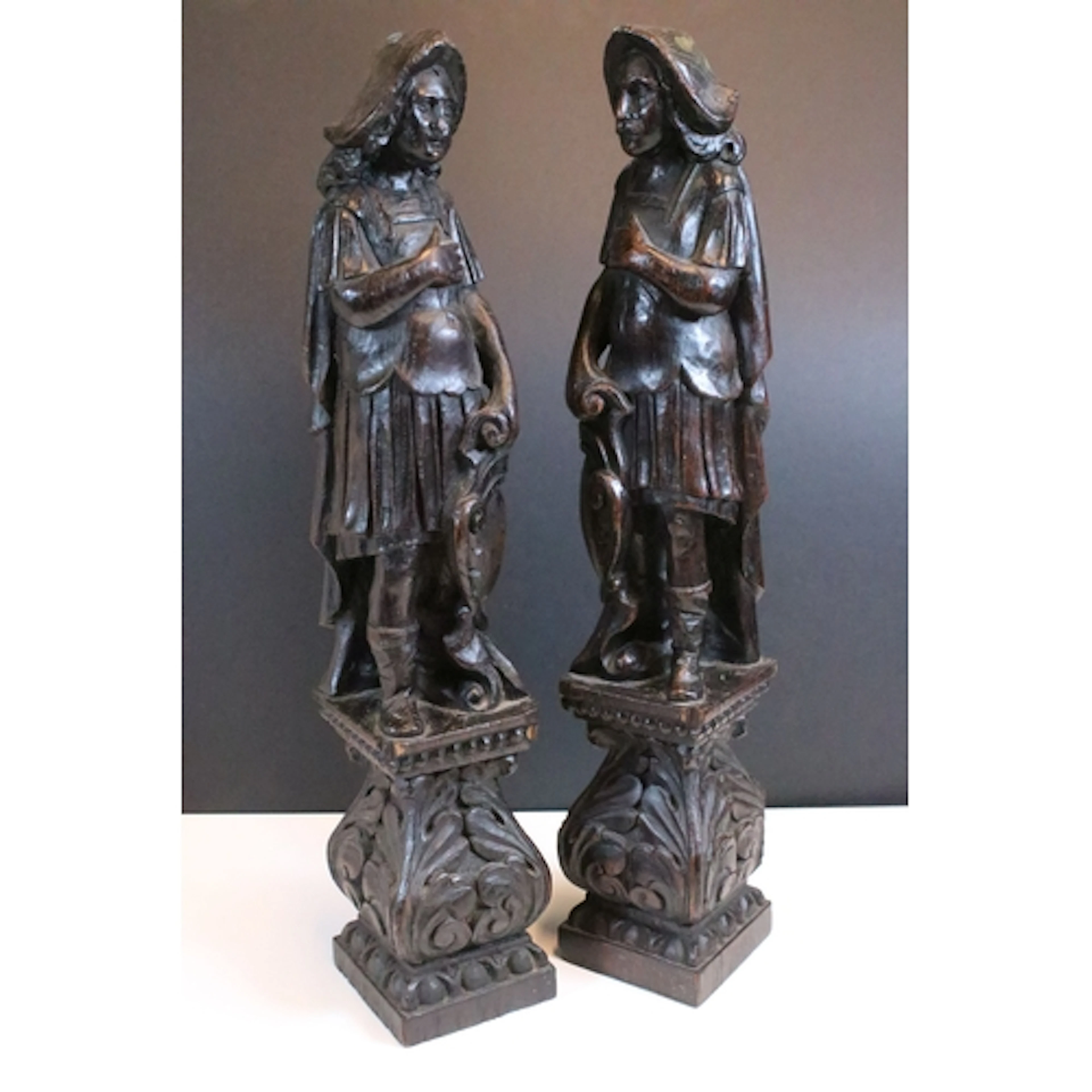 Pair of early 20th century carved oak figures, modelled with...