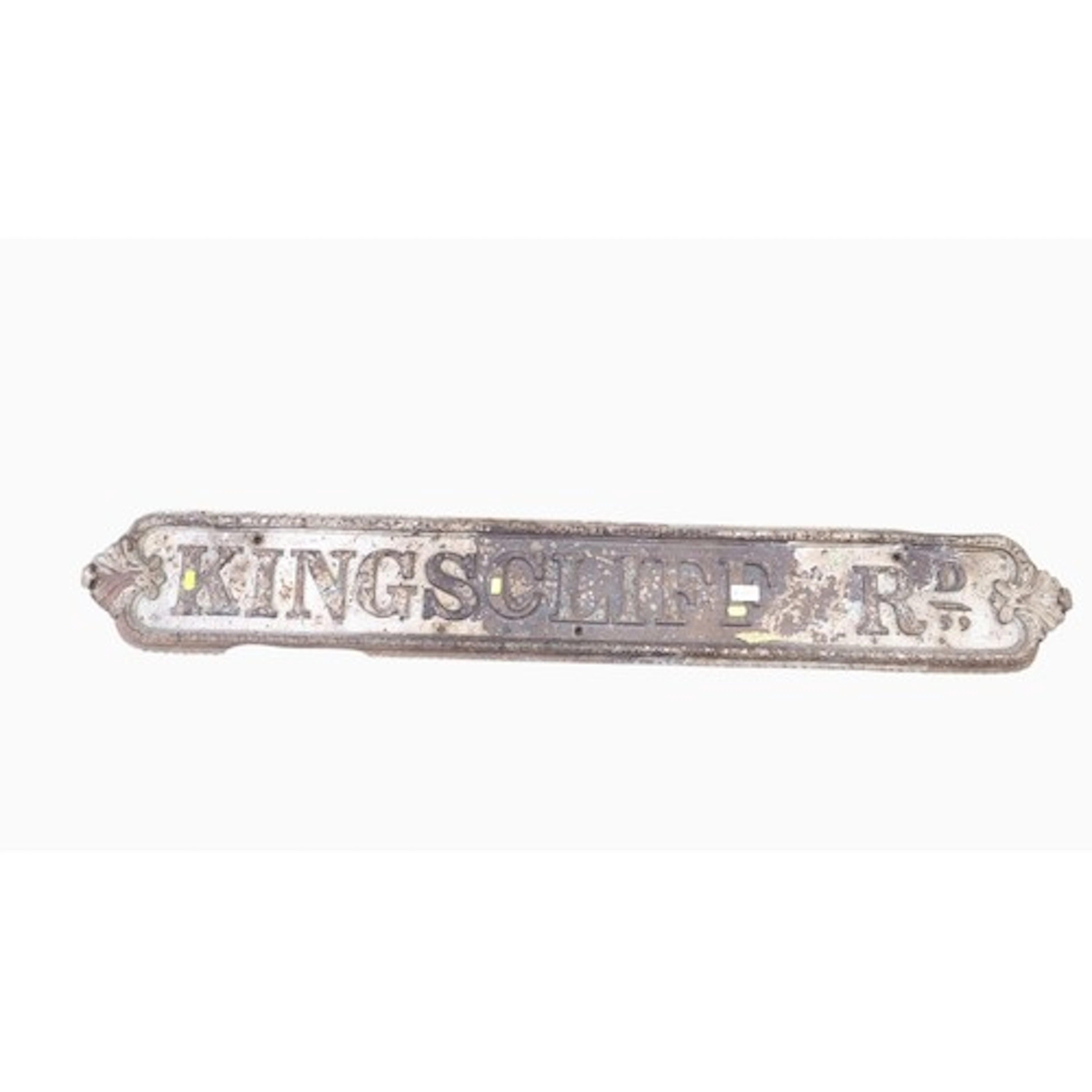 Cast-iron street sign reading ‘KINGSCLIFF RD.’ in raised ser...