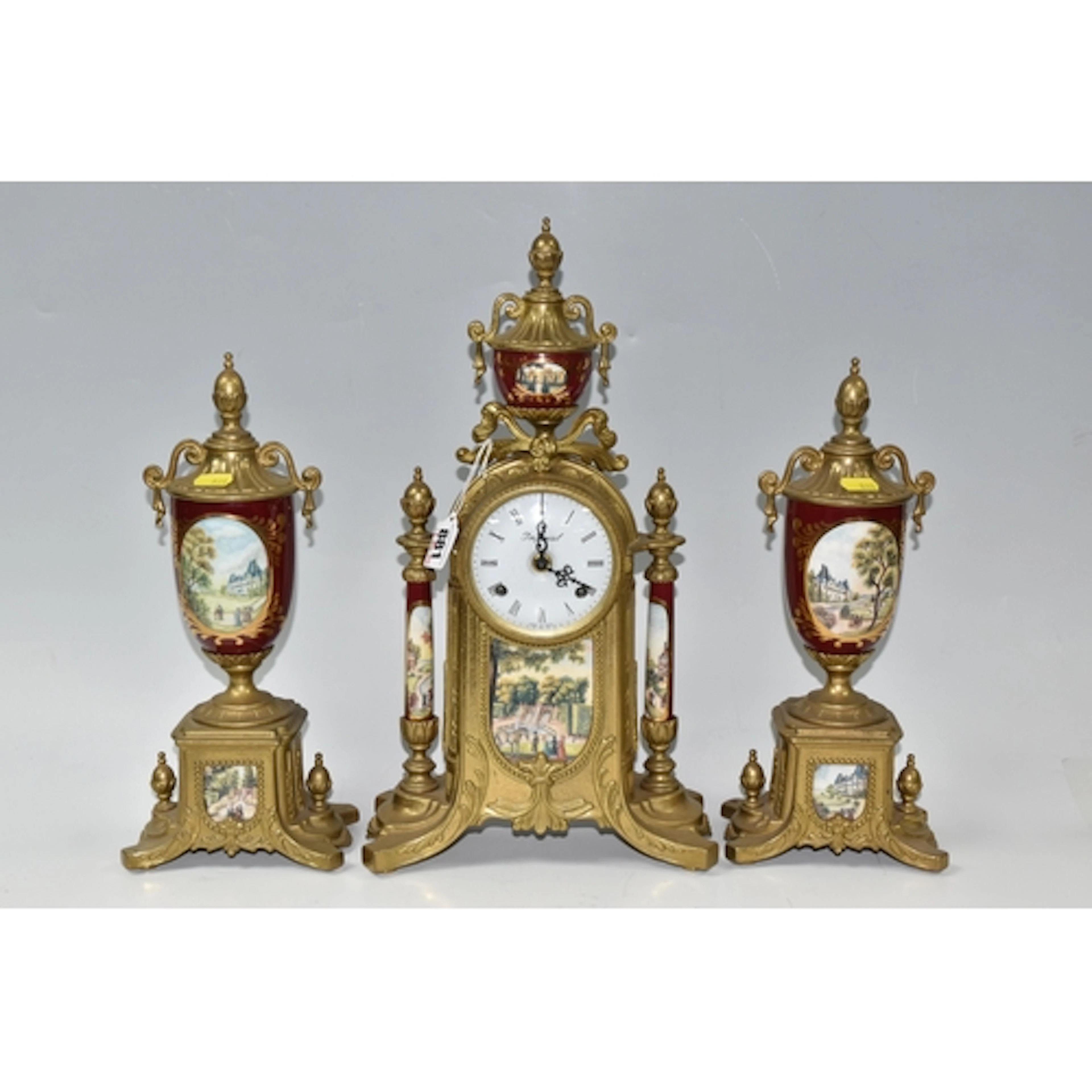 A KEY WOUND ITALIAN CLOCK WITH TWO GARNITURES circa late 20t...