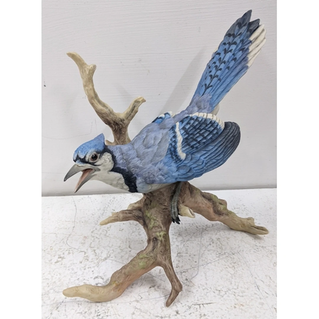 A Boehm porcelain model of a blue jay perched on a branch, 2...