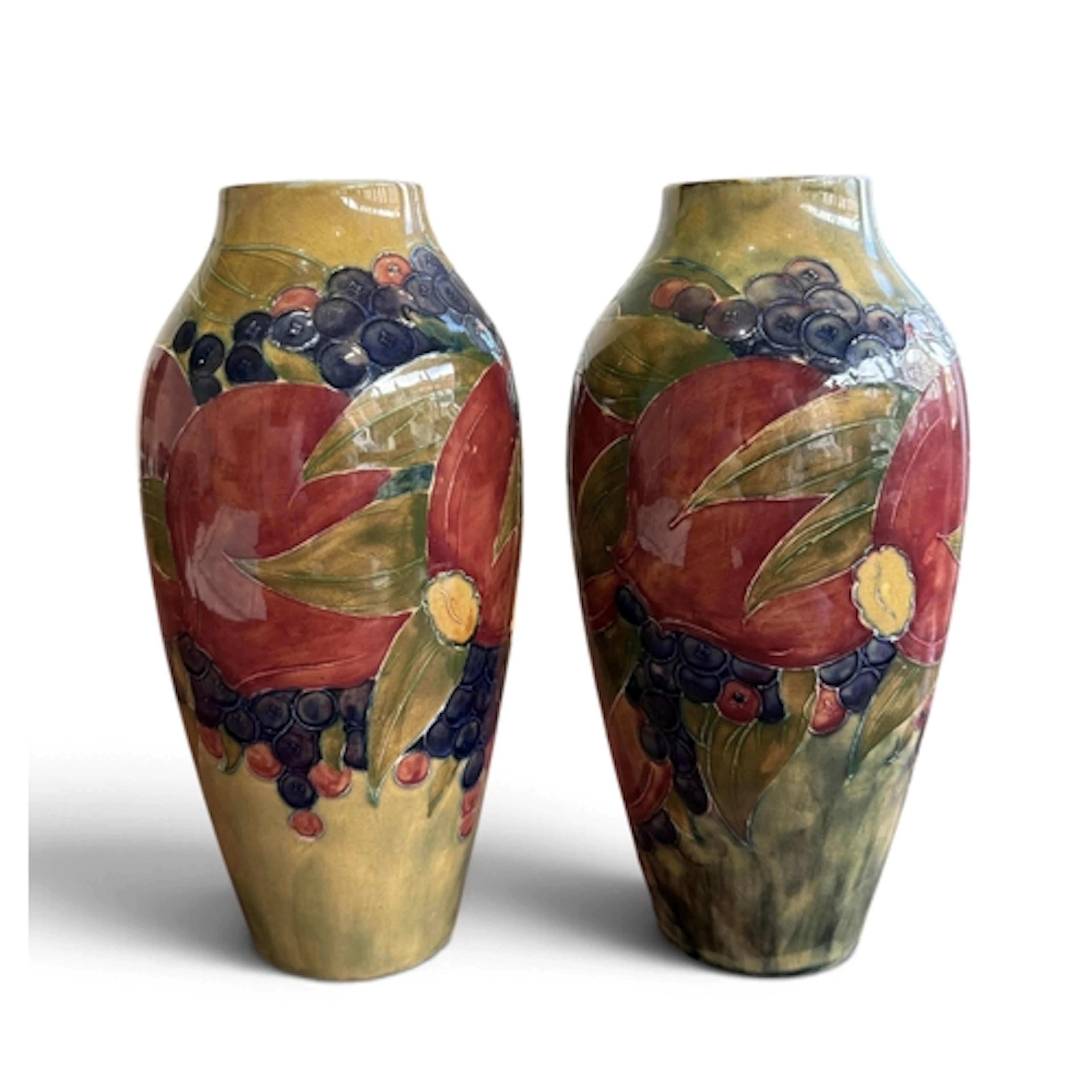 WILLIAM MOORCROFT: A PAIR OF POMEGRANATE PATTERN TUBE LINED ...