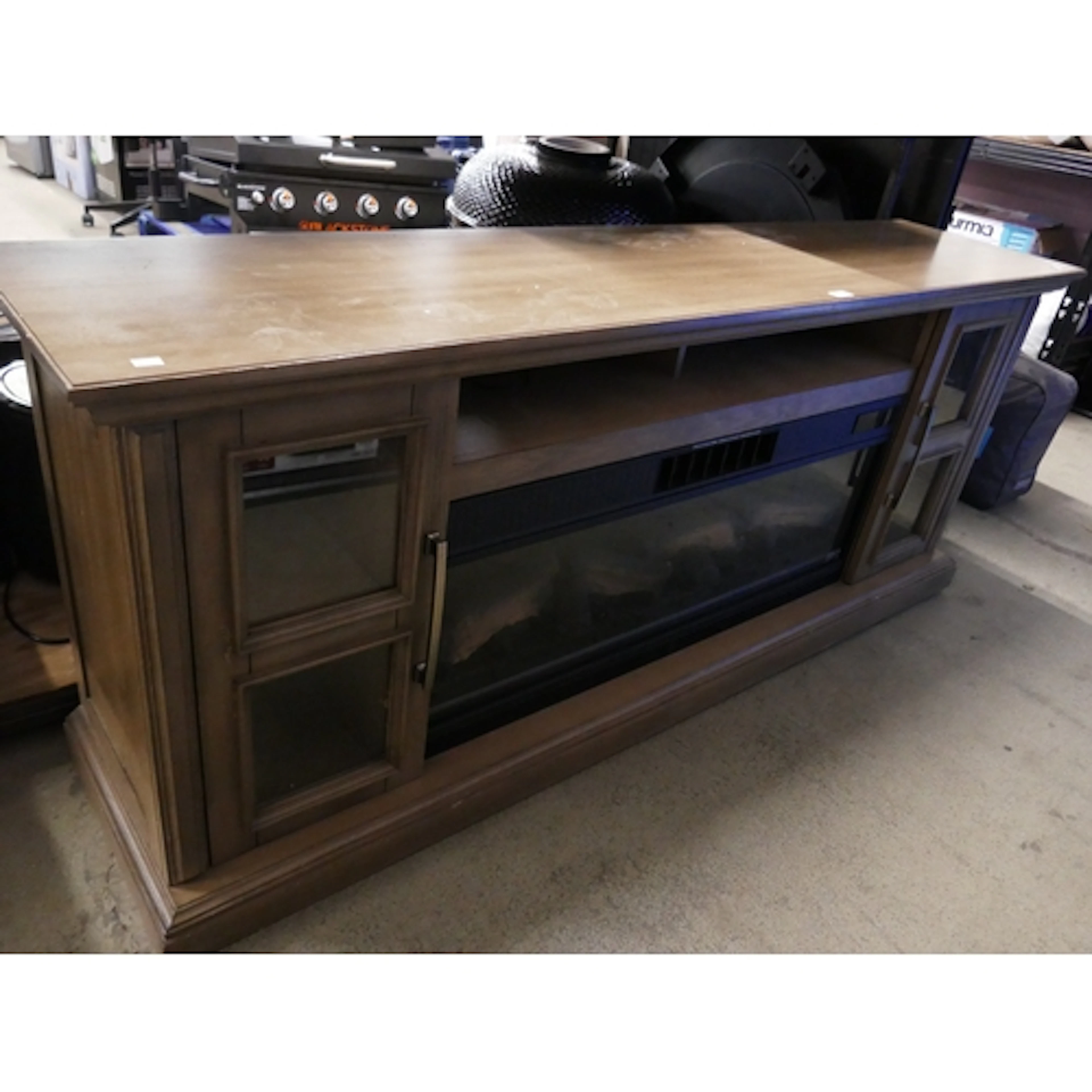 A Nottingham media mantle sideboard with built in electric f...