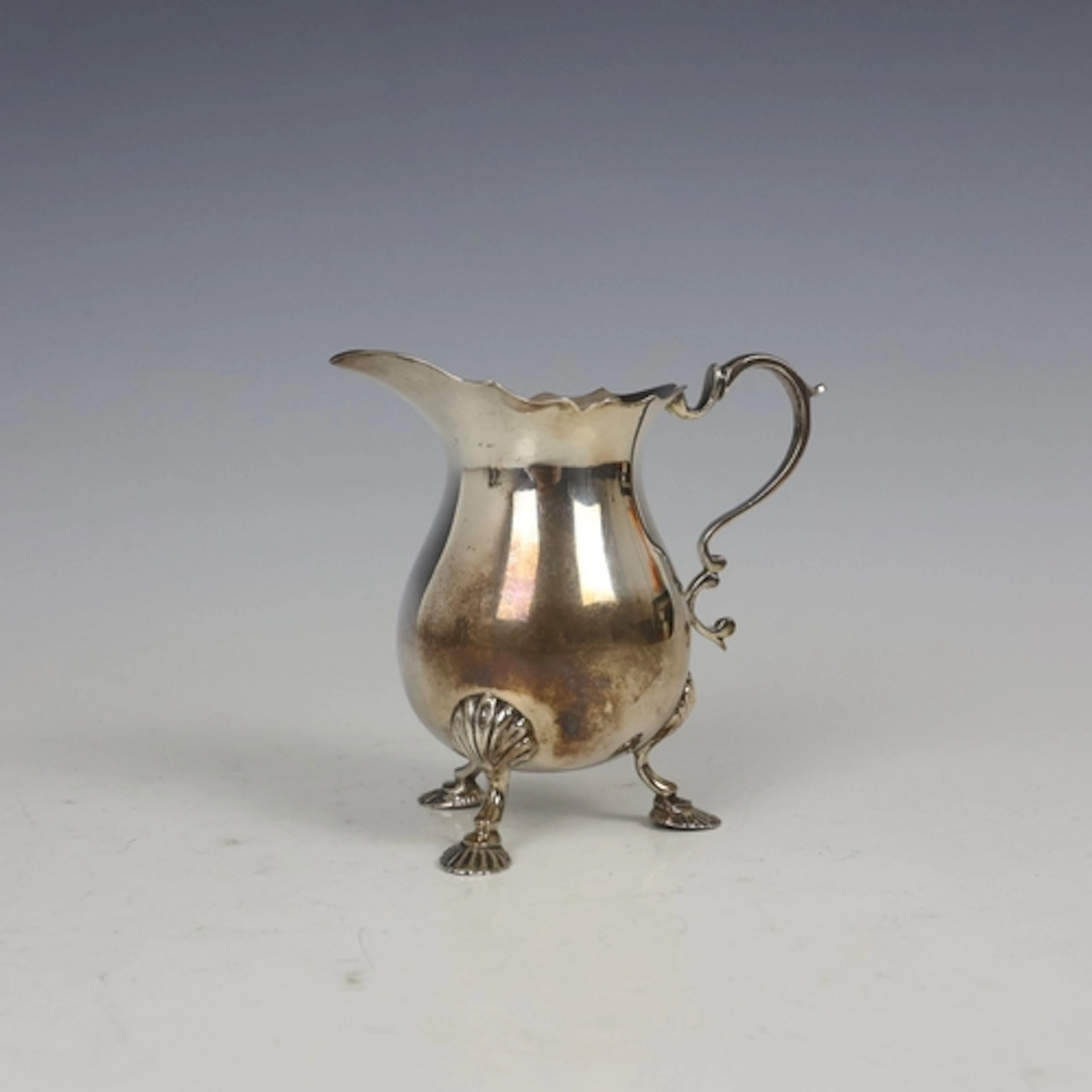 A mid 20th century silver milk jug, Lowe & Sons, Chester 196...