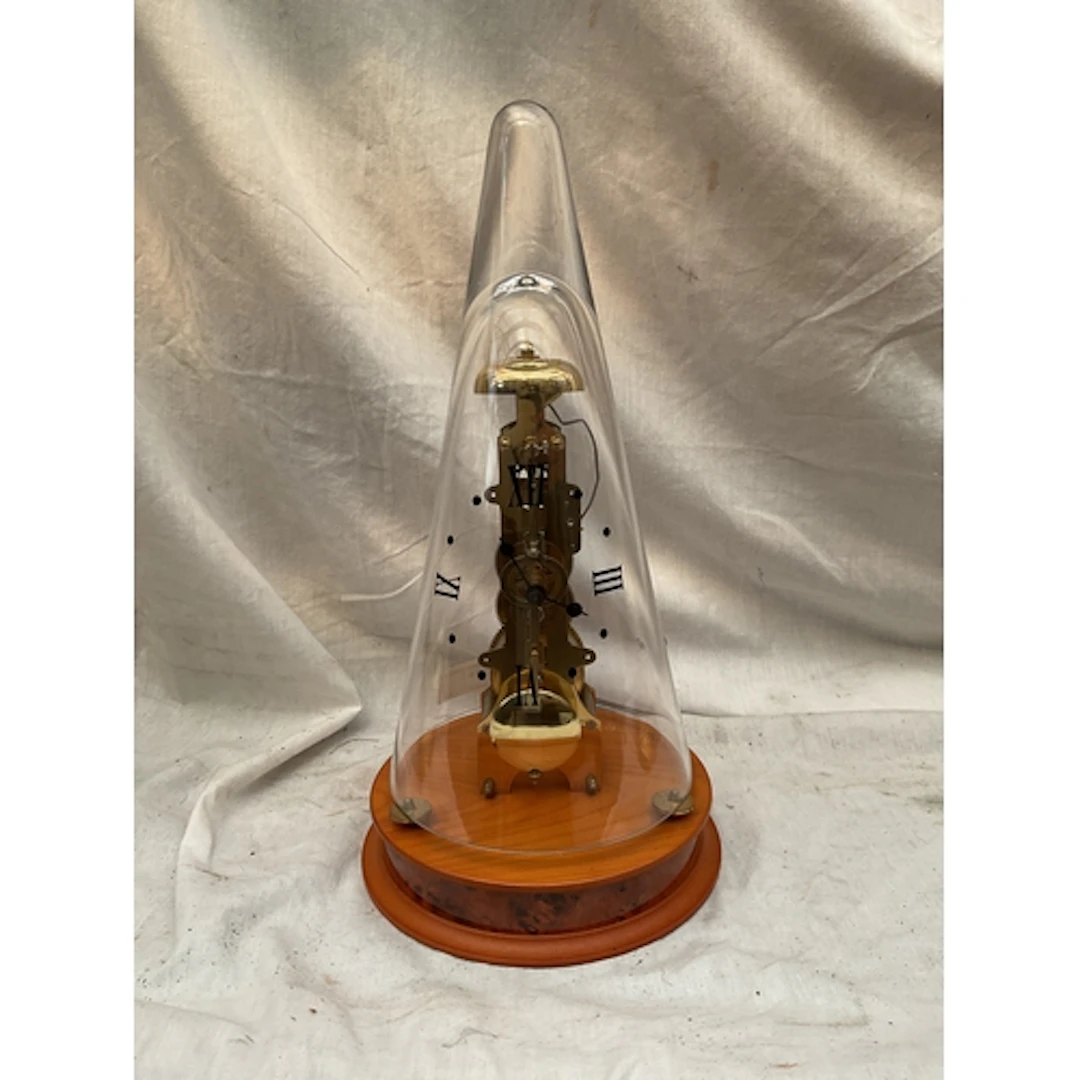 Franz Hermle striking clock under glass numeral cone.