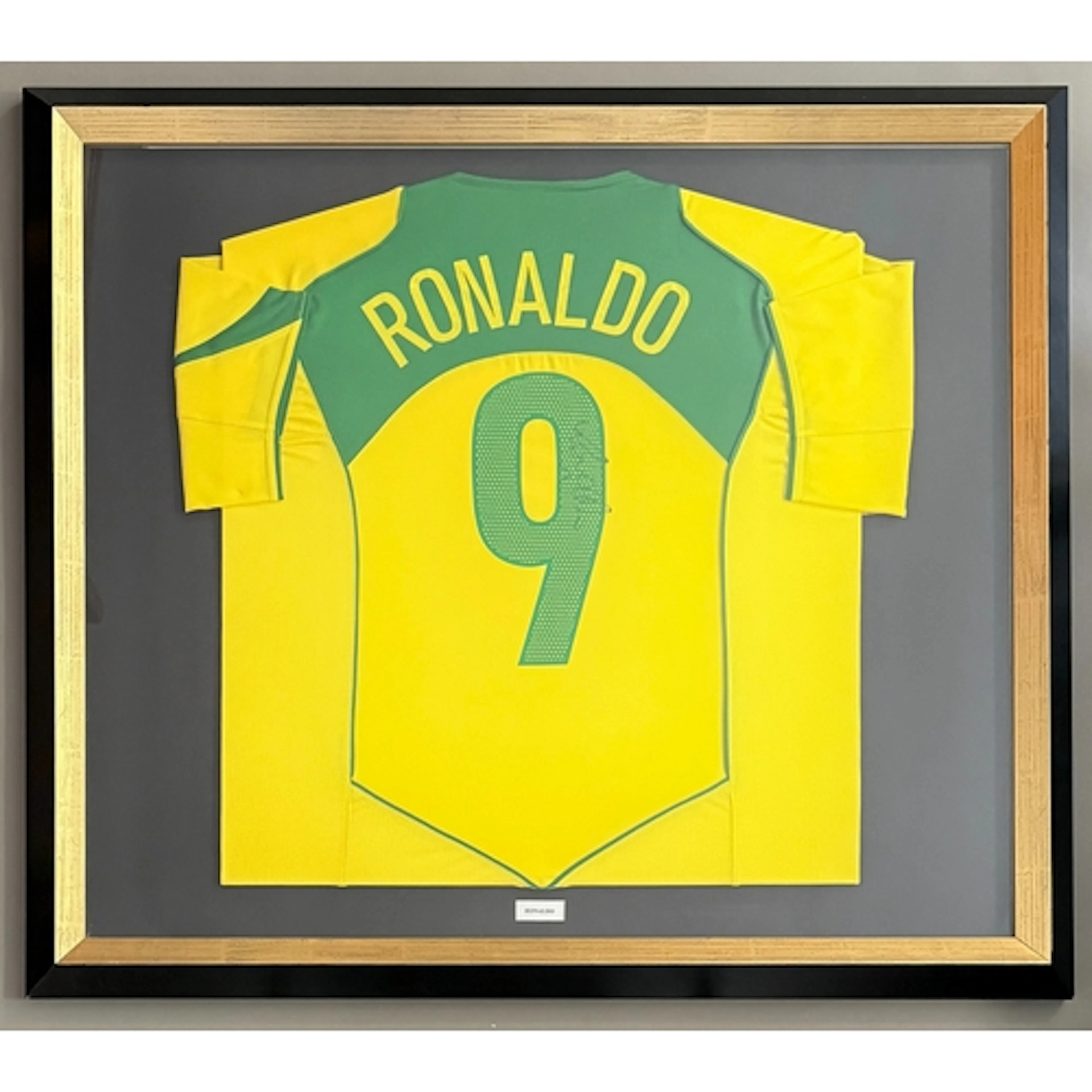 Ronaldo: a signed replica yellow and green Brazil No.9 inter...
