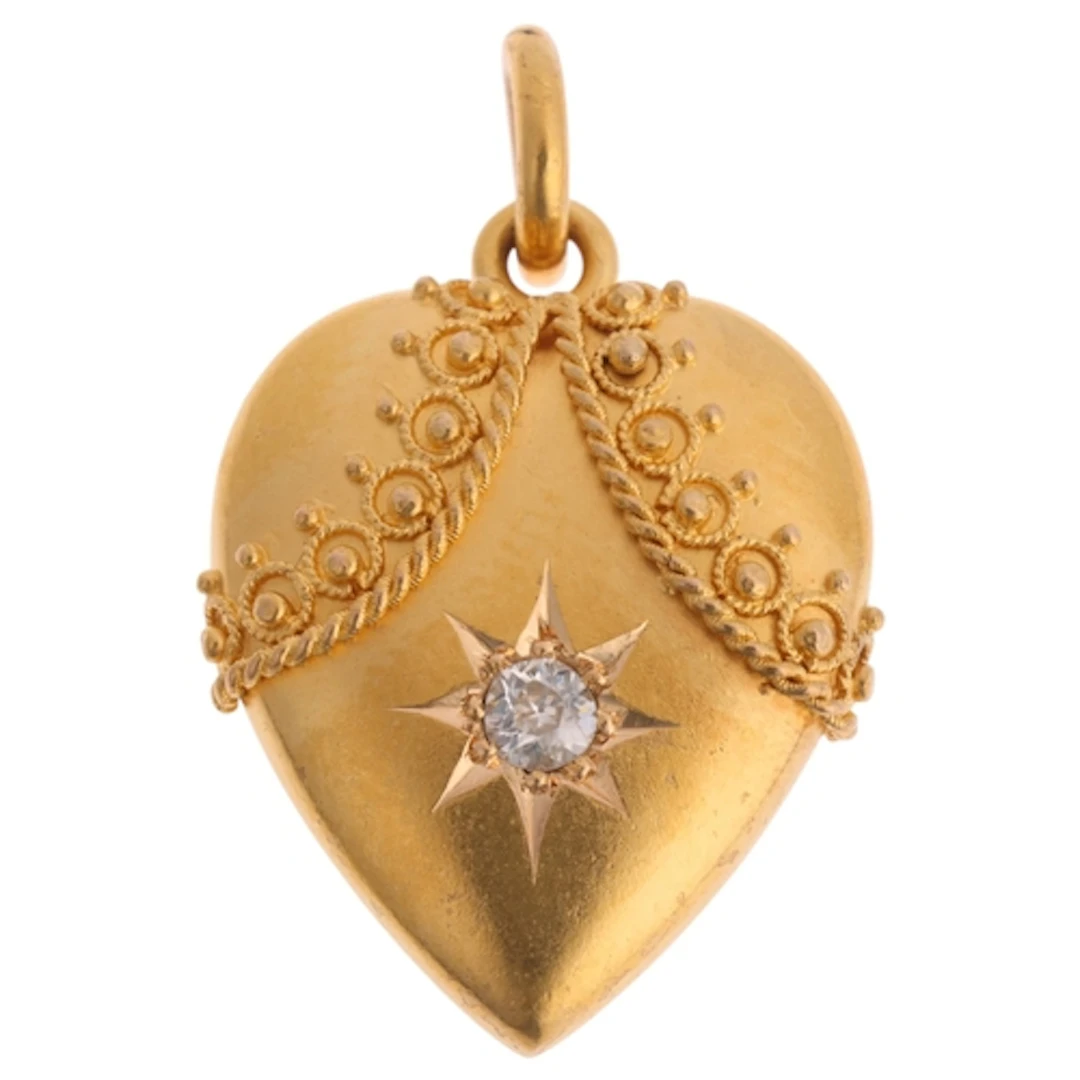 An Antique Etruscan Revival 15ct gold diamond heart pendant,...