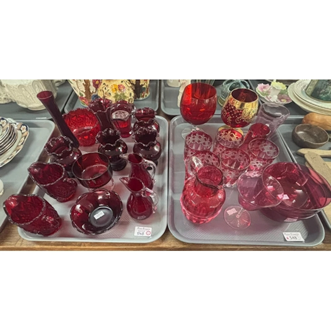 Two trays of ruby and cranberry glass items, to include flas...