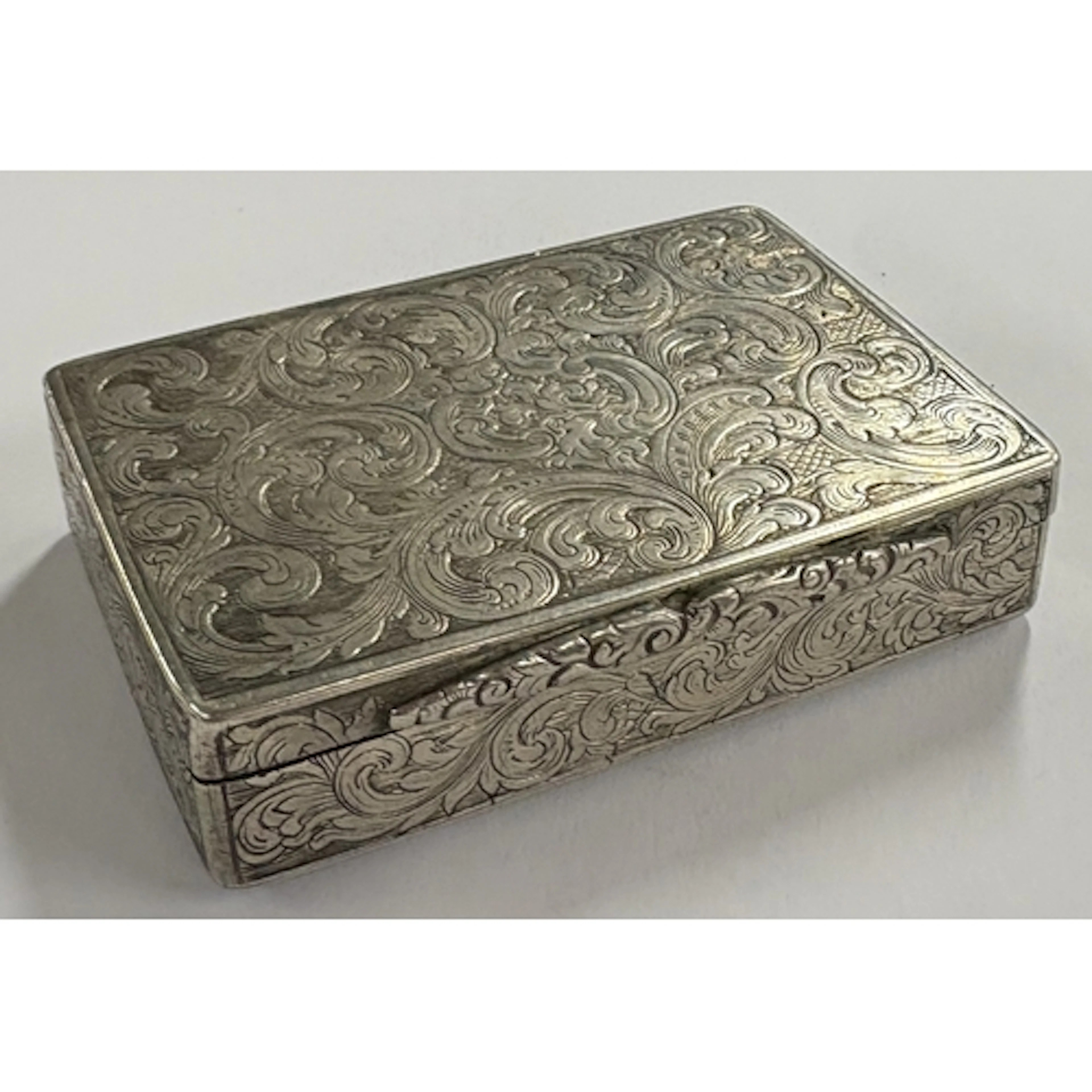 A Victorian silver snuff box with engraved decoration. Birmi...
