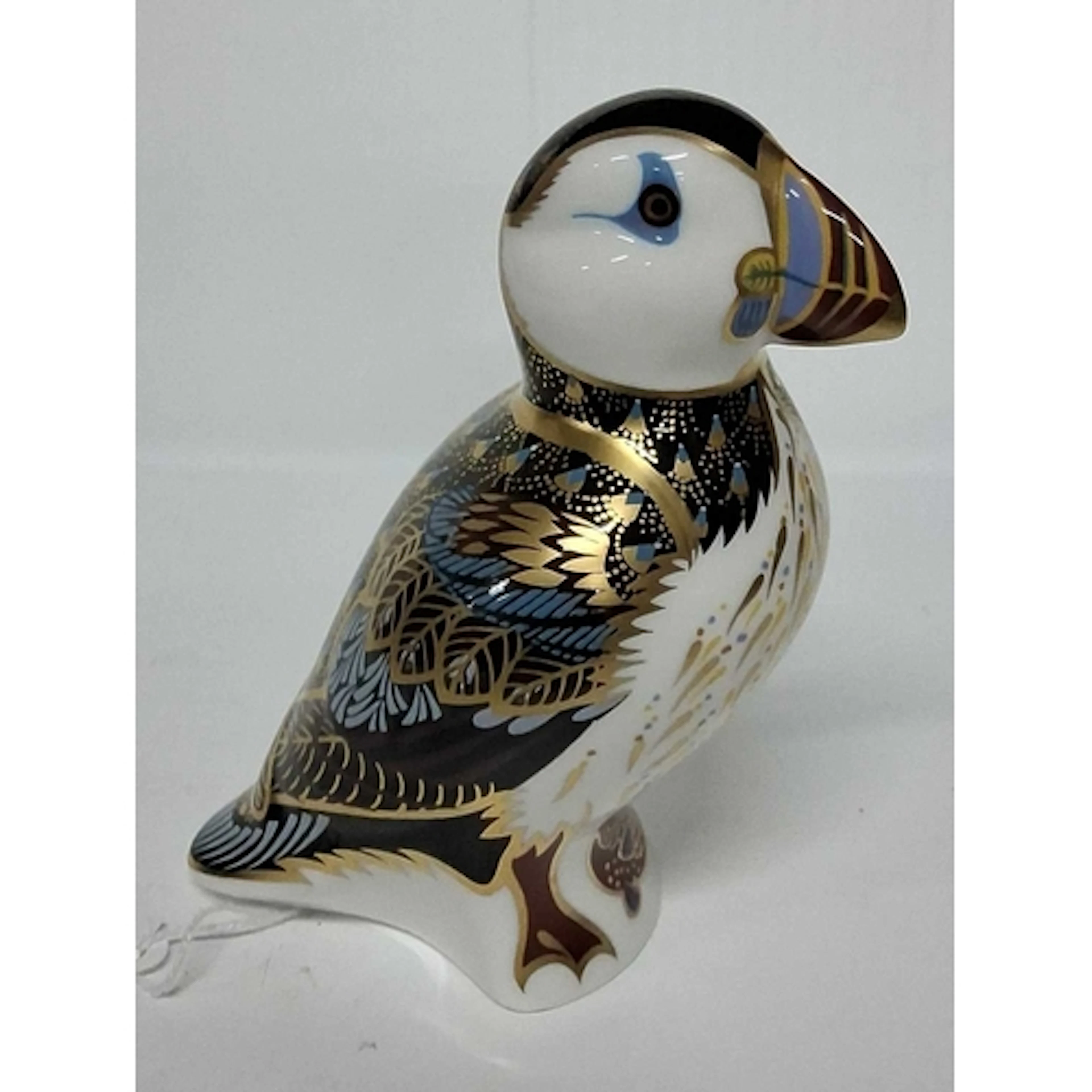 A ROYAL CROWN DERBY PUFFIN PAPERWEIGHT, with gold stopper, h...