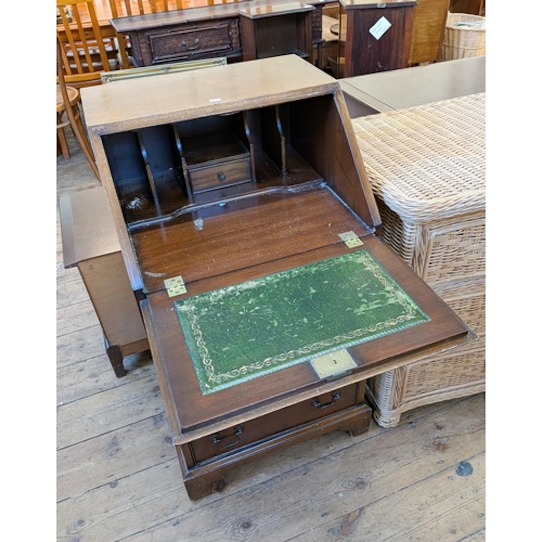 A ladies Georgian style mahogany bureau with four drawers un...