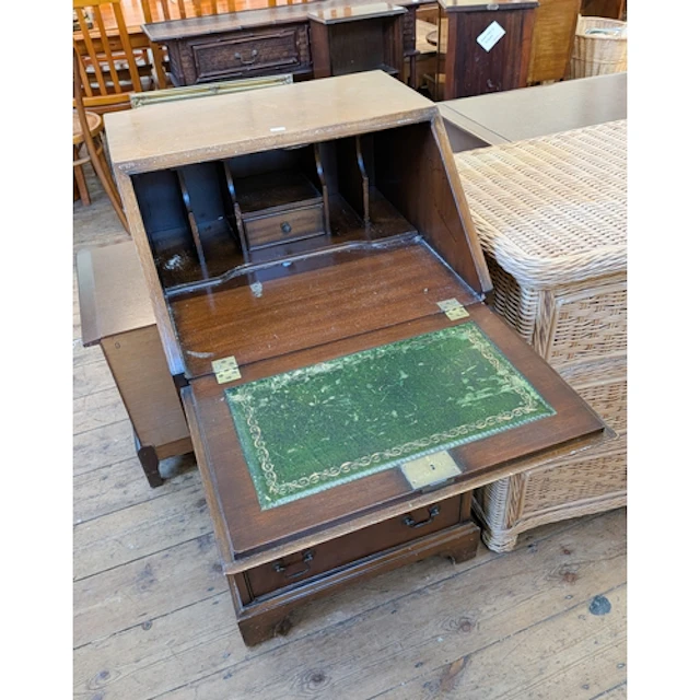 A ladies Georgian style mahogany bureau with four drawers un...