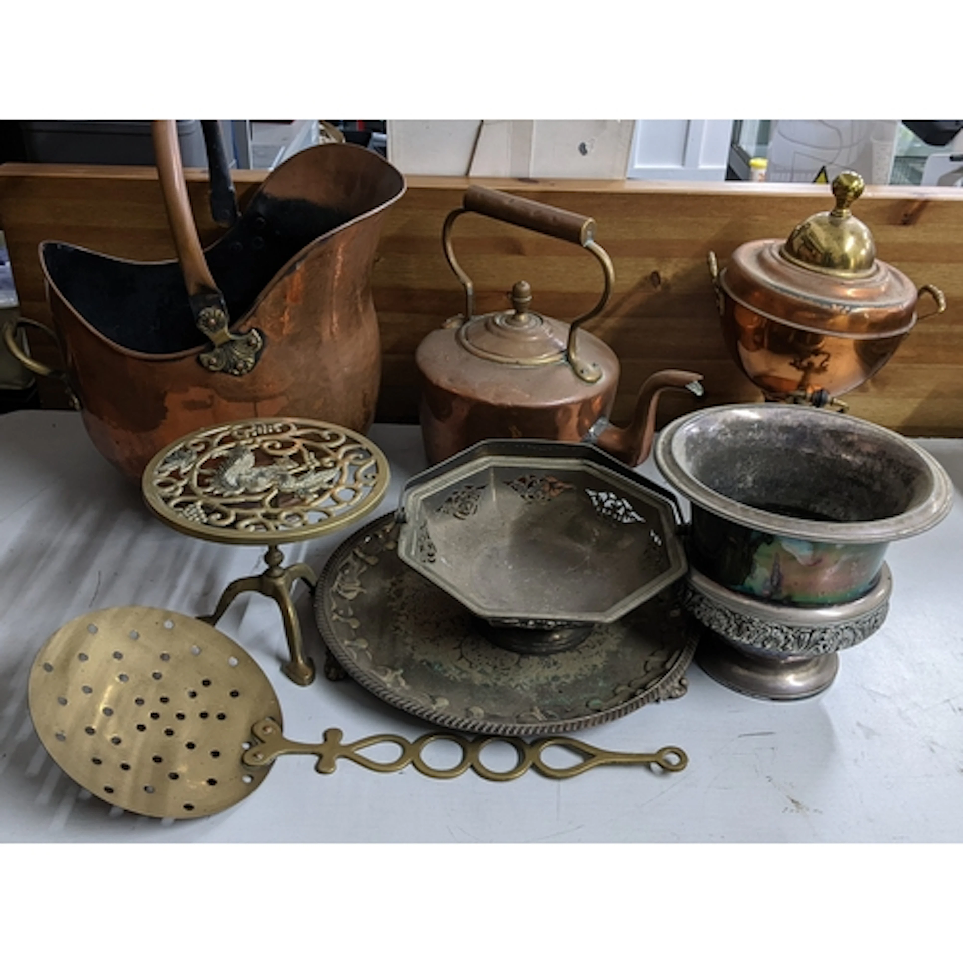 A mixed lot of metalware to include a copper samovar, silver...
