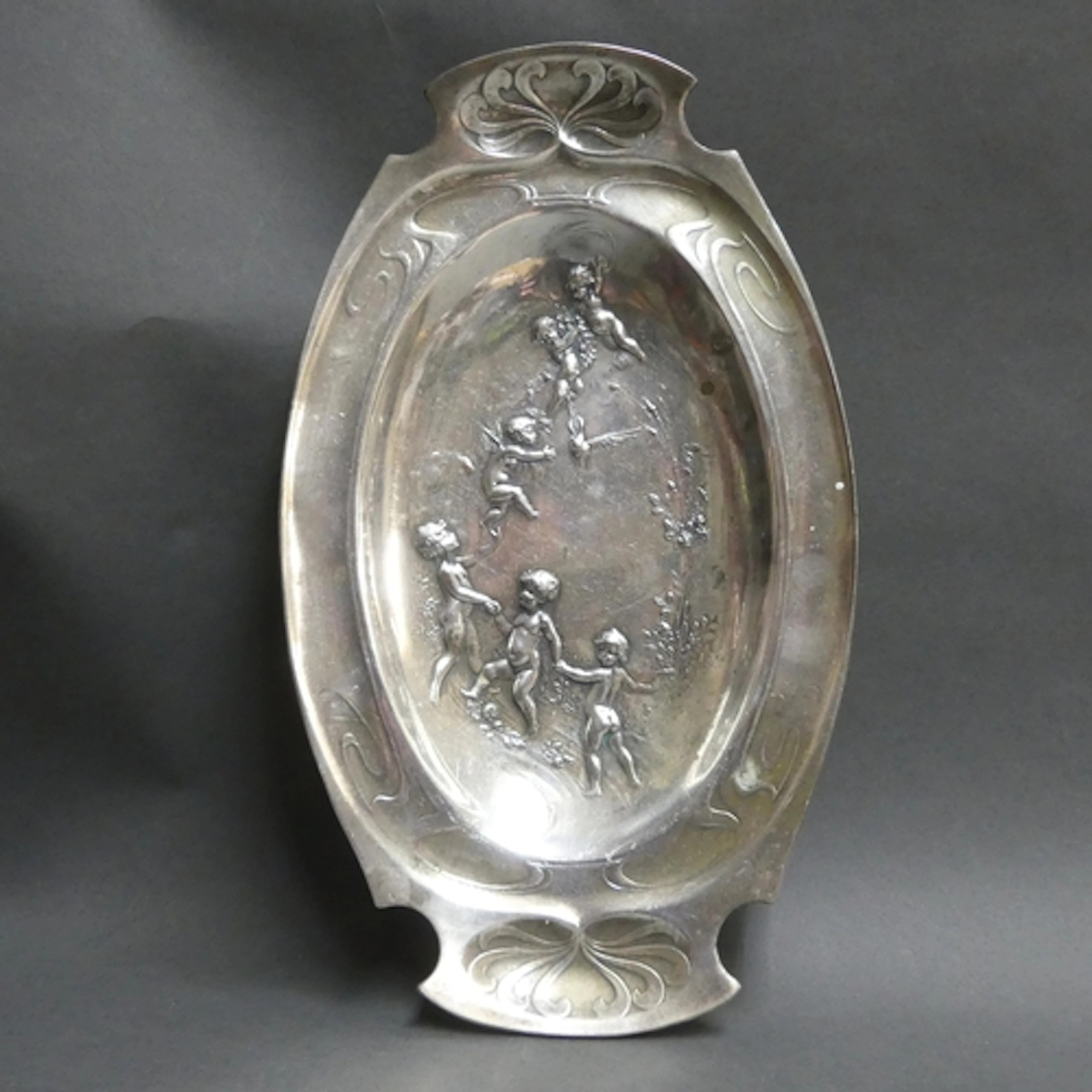 An Art Nouveau silver plated twin handled oval serving dish,...