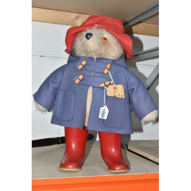A GABRIELLE DESIGNS PADDINGTON BEAR SOFT TOY, wearing a blue...