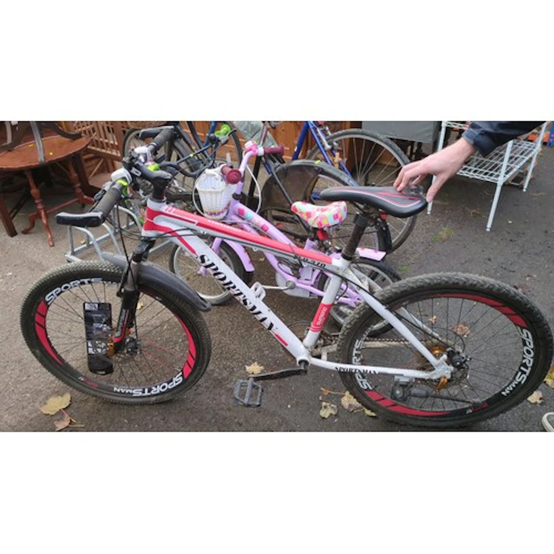 Sportsman mountain bicycle with a white and red frame, front...