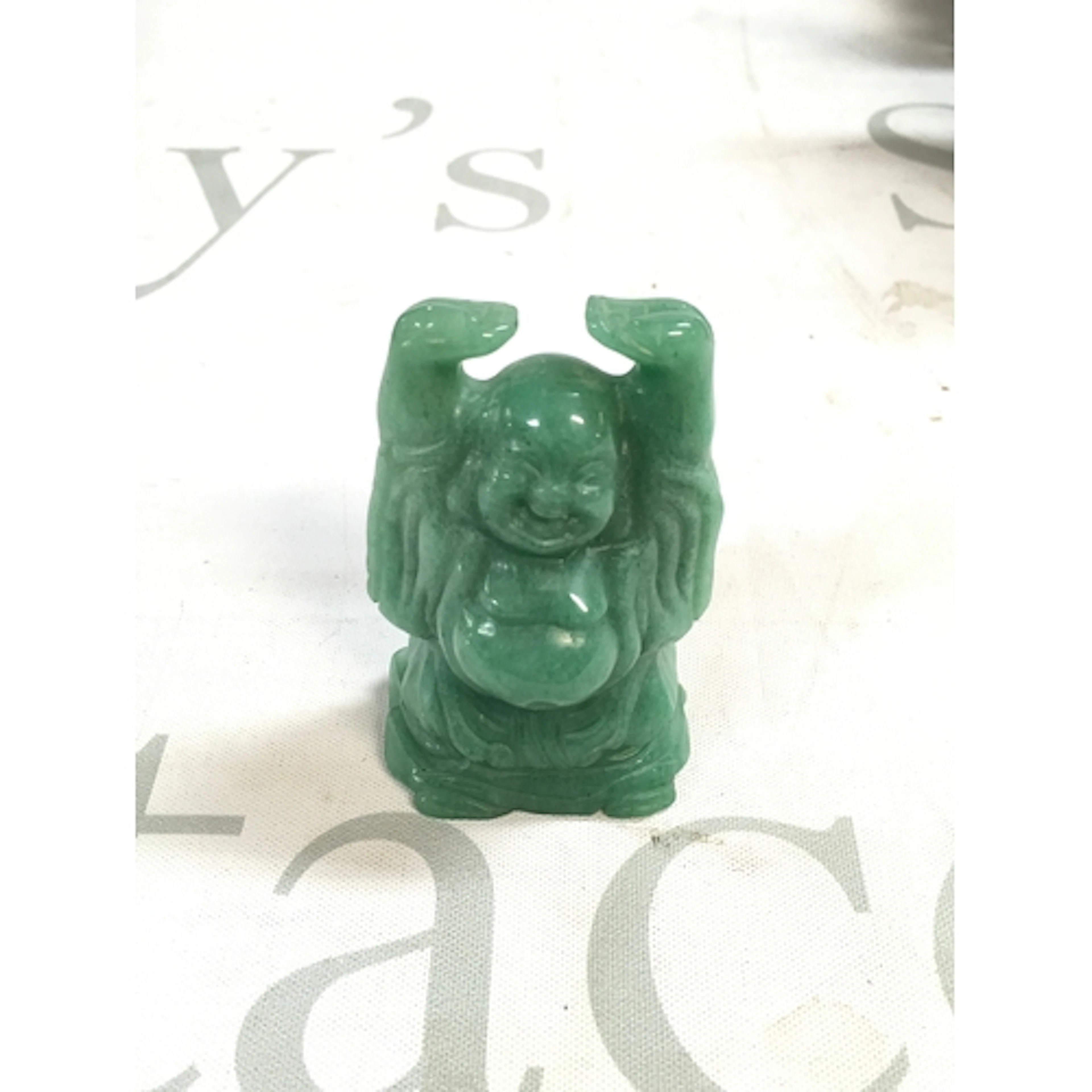 A 20th century small jade Buddha. Height 7cm.