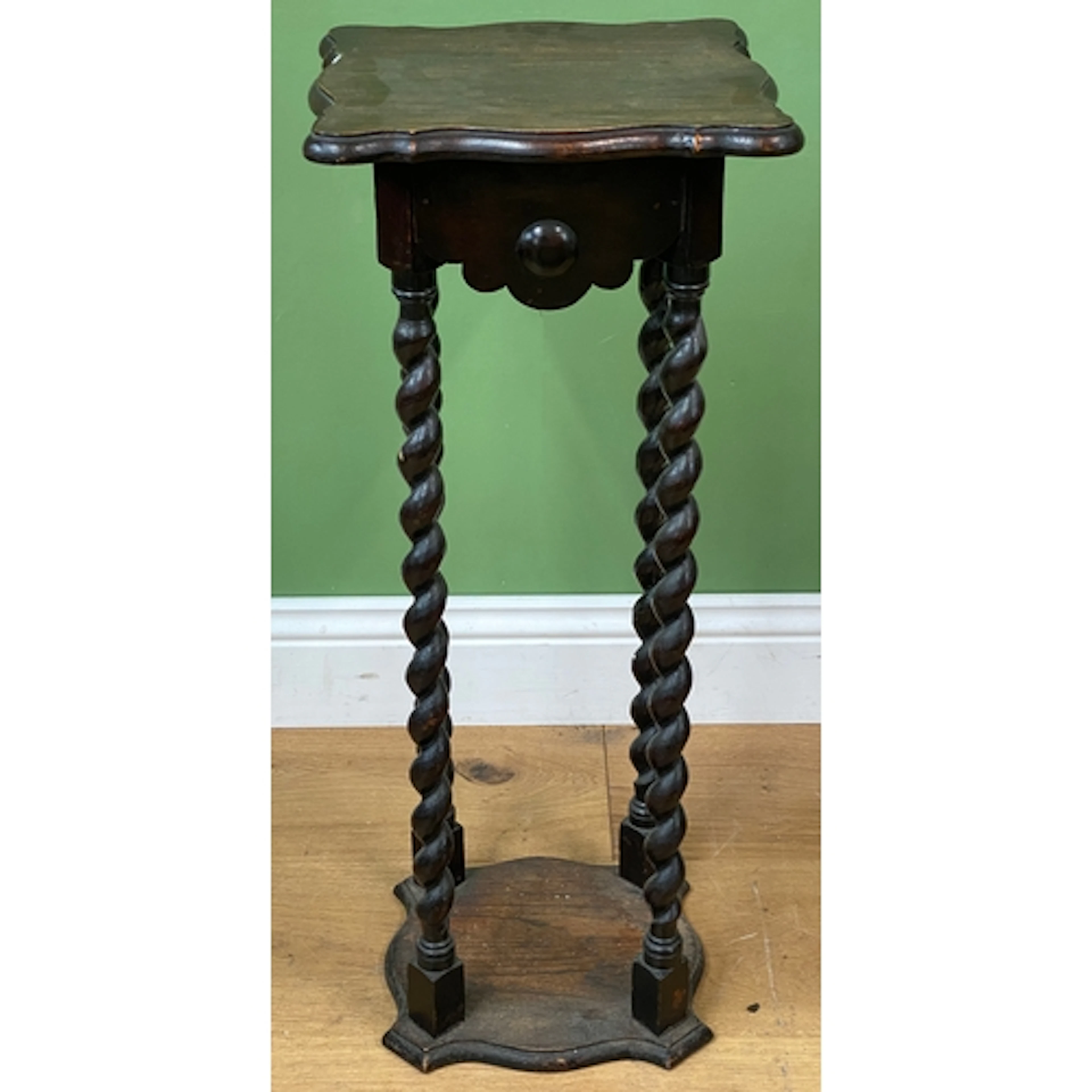 An oak lamp table or pot stand on tall barley twist supports...