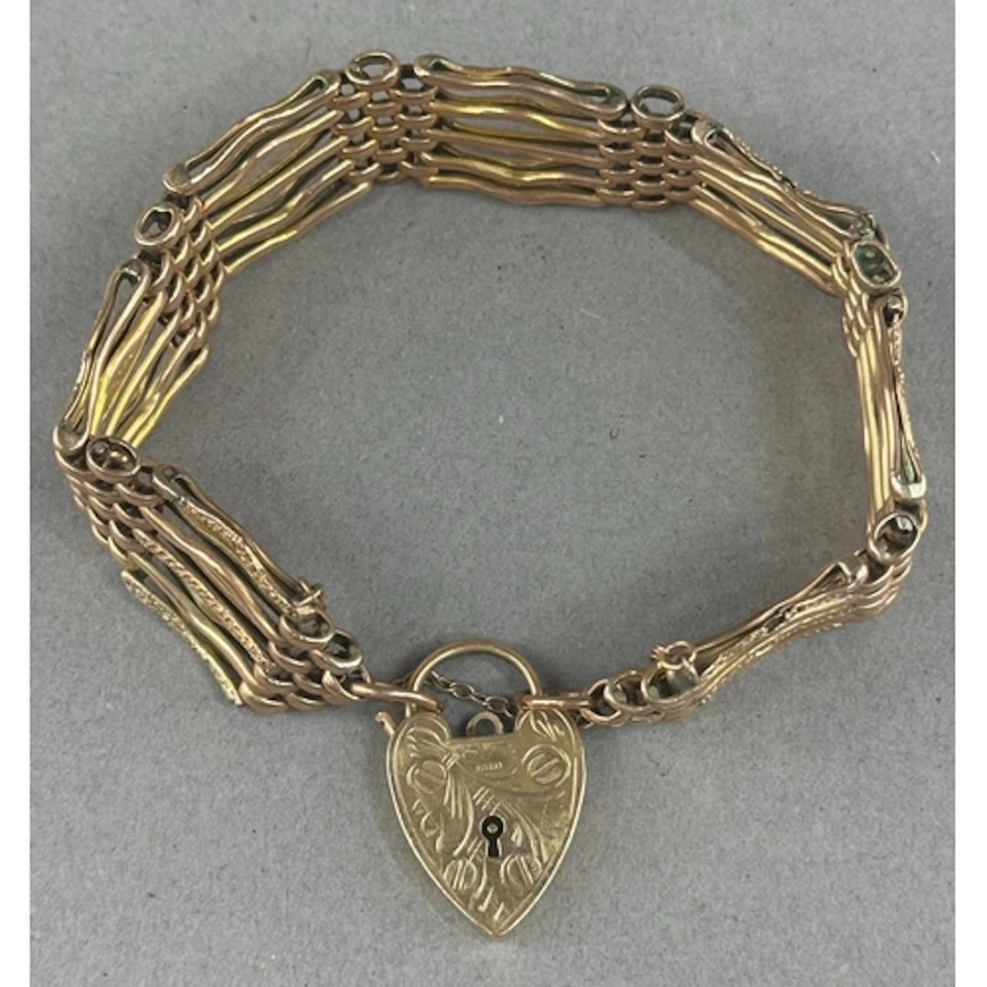 Jewellery- 9ct gold gate bracelet with padlock, engraved dec...