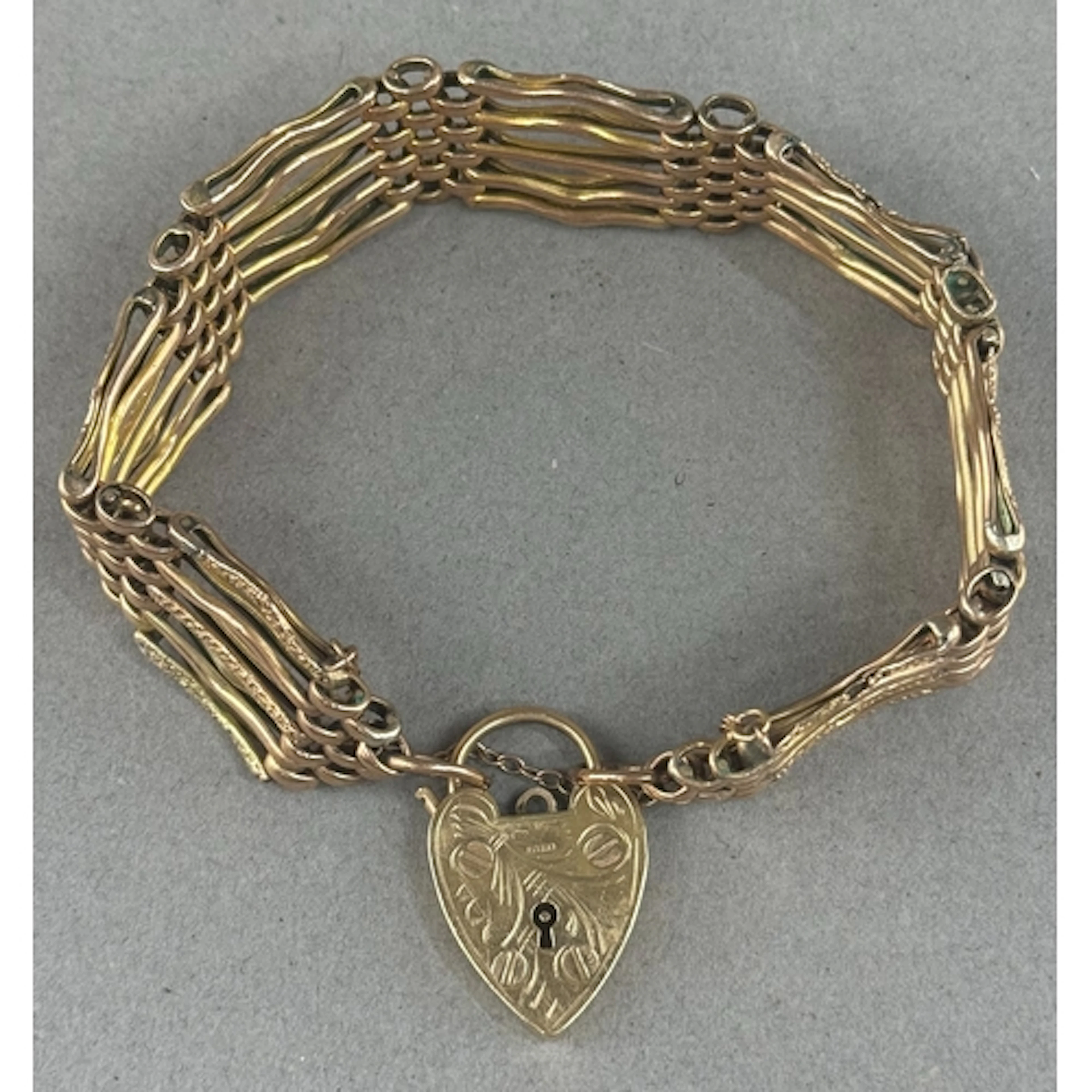 Jewellery- 9ct gold gate bracelet with padlock, engraved dec...
