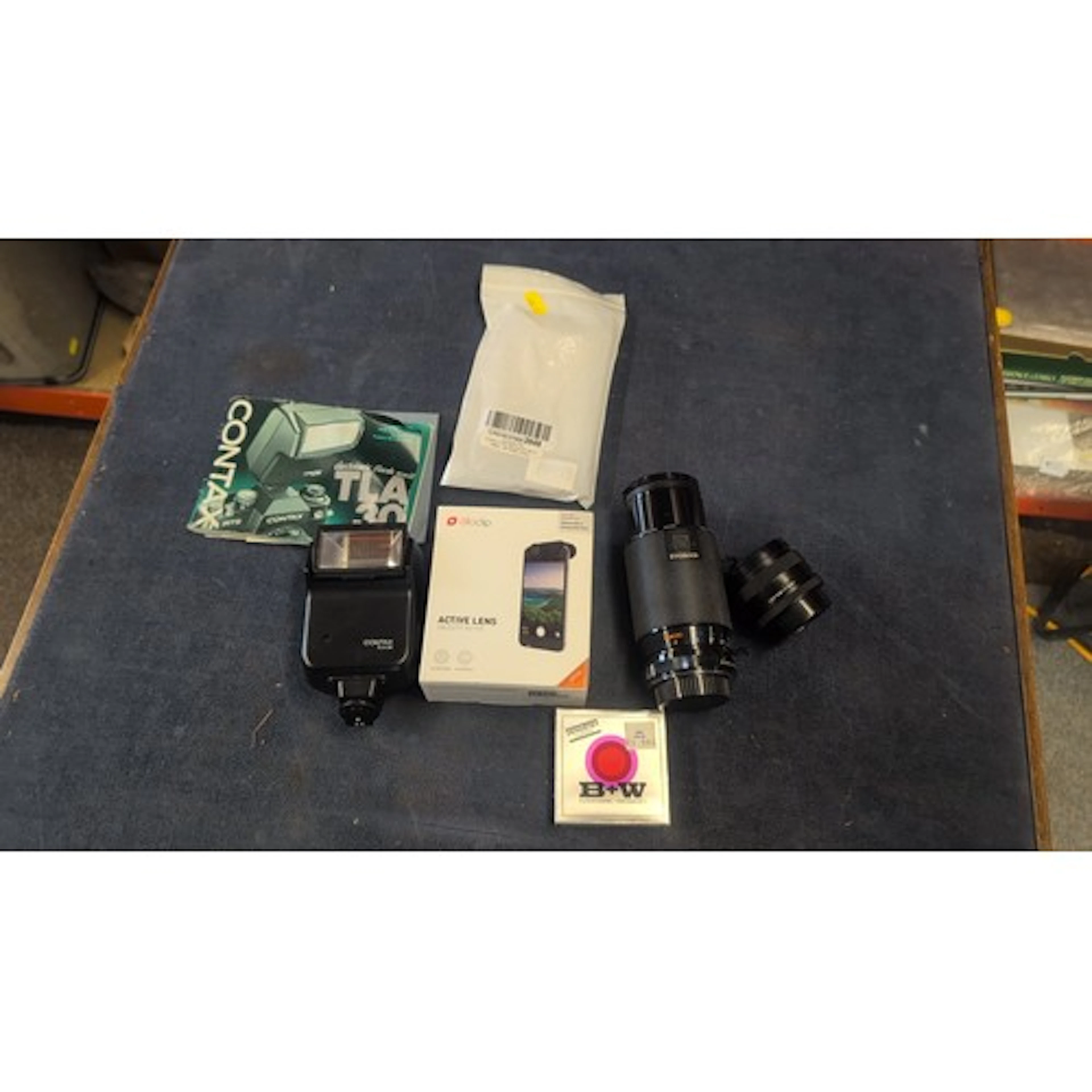 A group of camera accessories including a Contax TLA 30 elec...