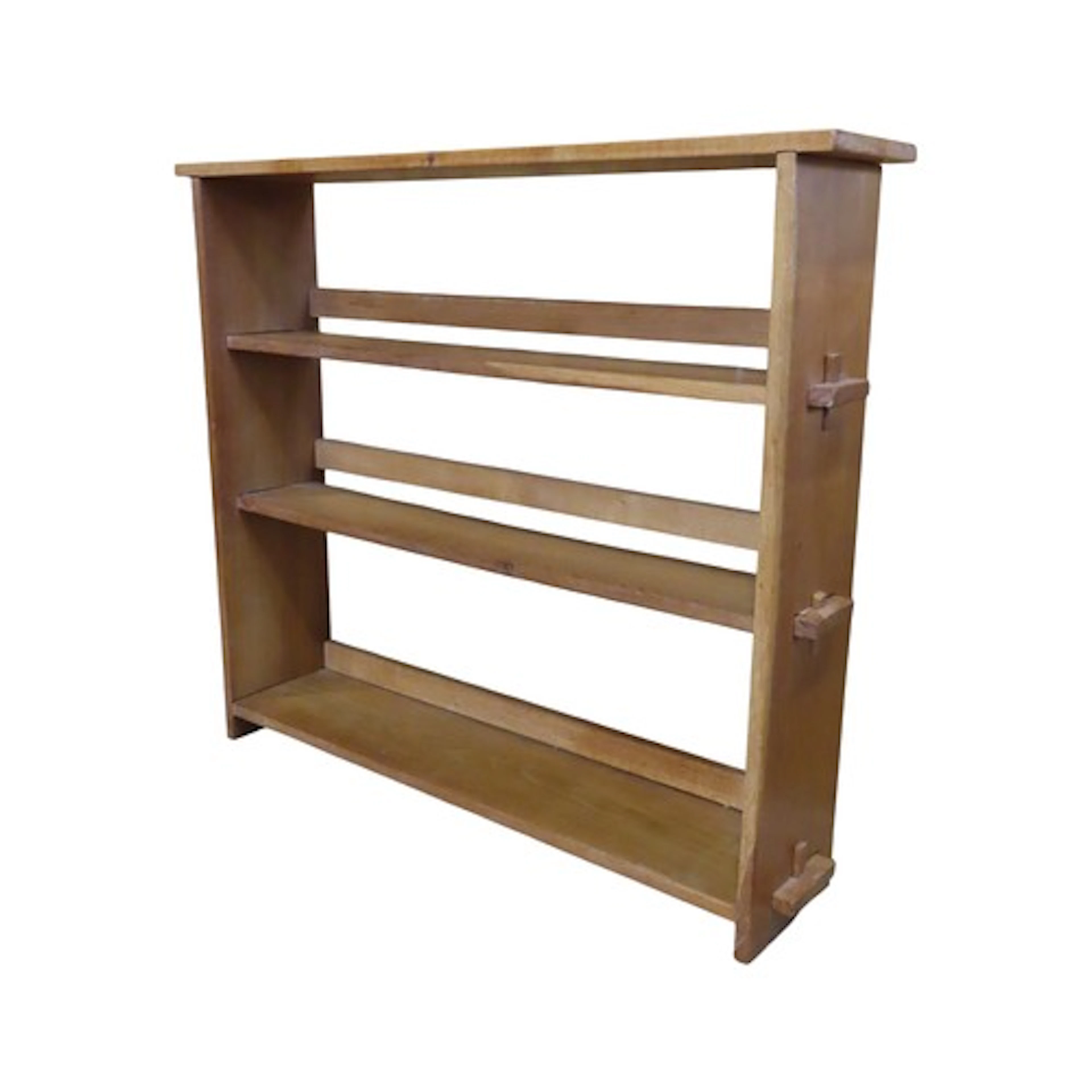 An Arts & Crafts floorstanding open bookcase with fixed peg ...