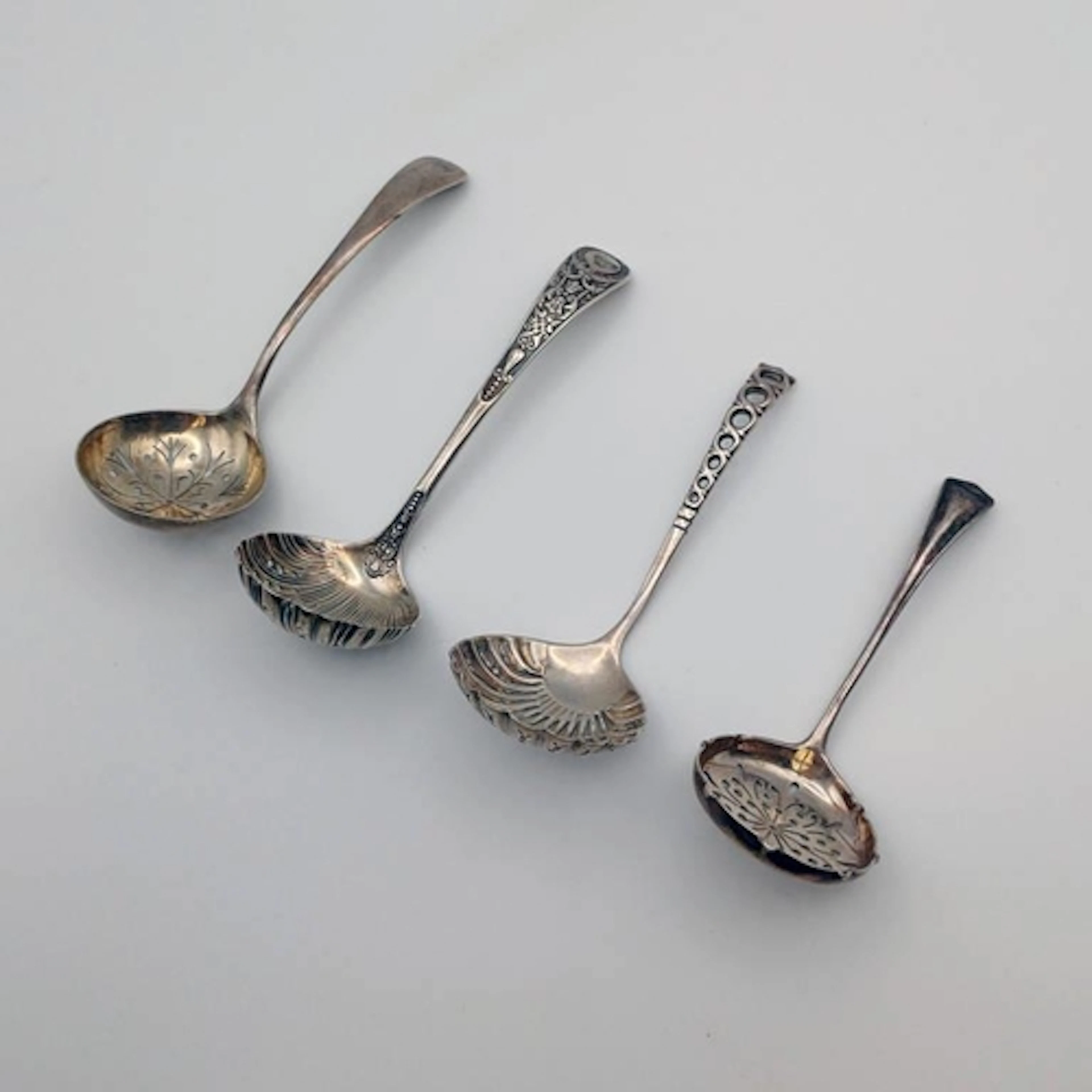 4 SILVER SUGAR SIFTER LADLES TO INCLUDE ONE BY WILLIAM GALLI...