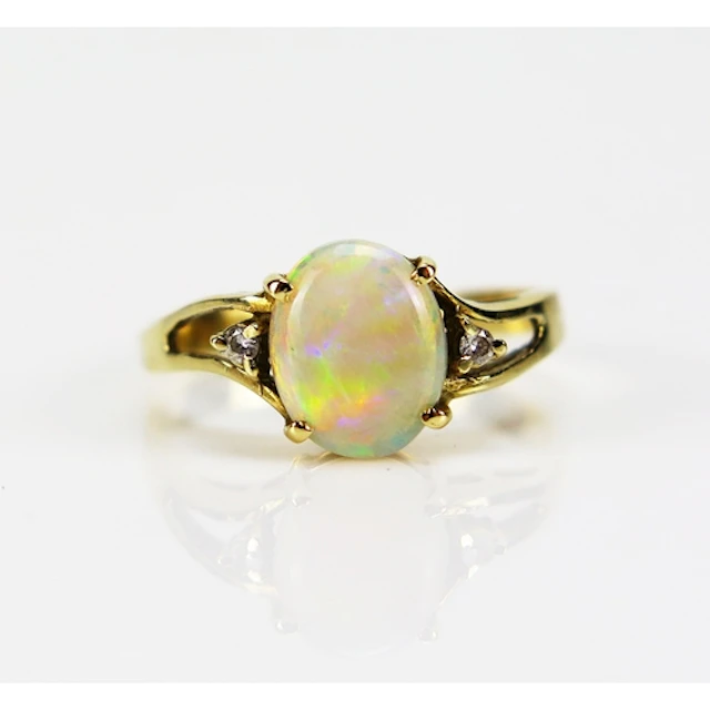 A singlet opal and diamond ring in a 14ct yellow gold settin...