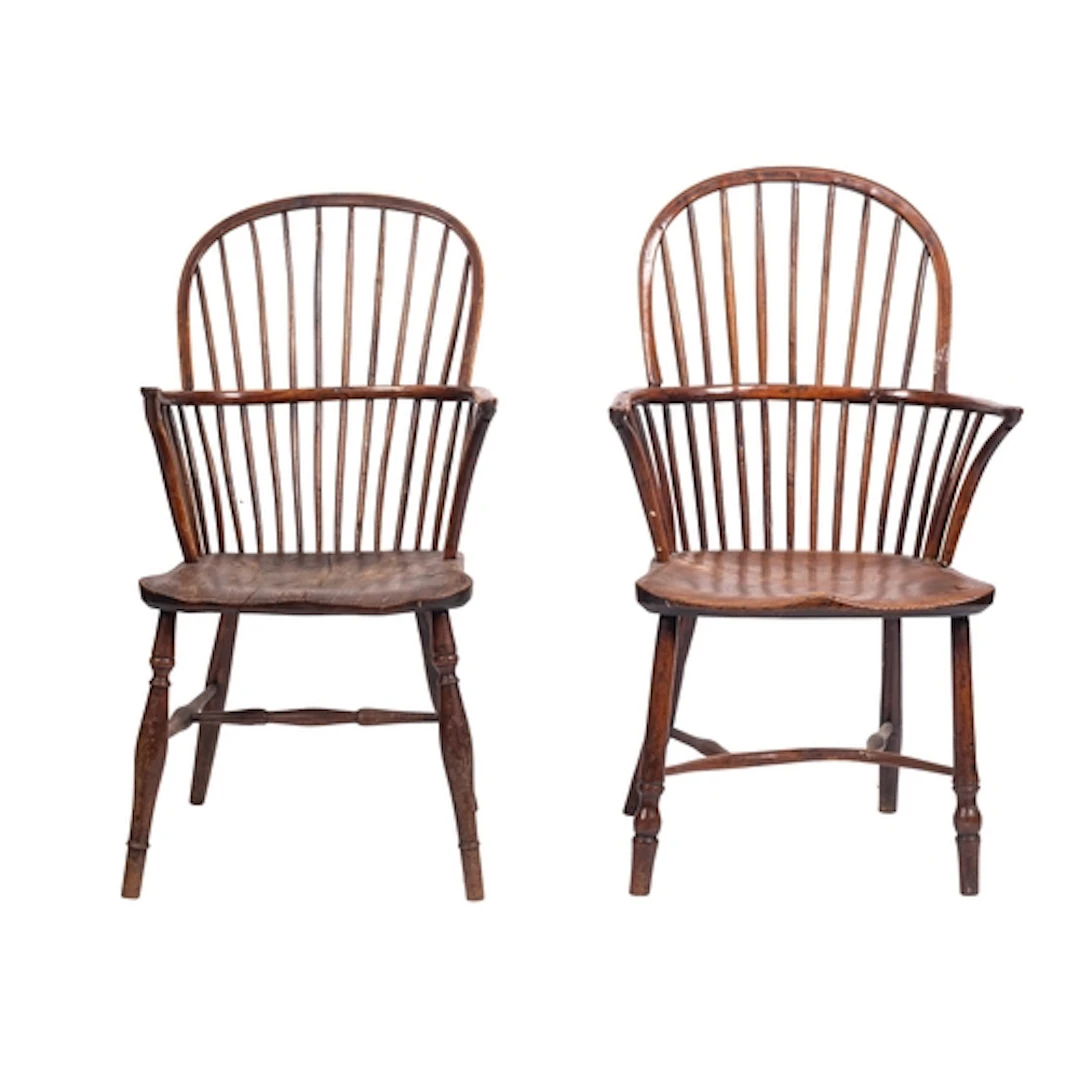 Two similar elm and yew Windsor elbow chairs, 19th century; ...