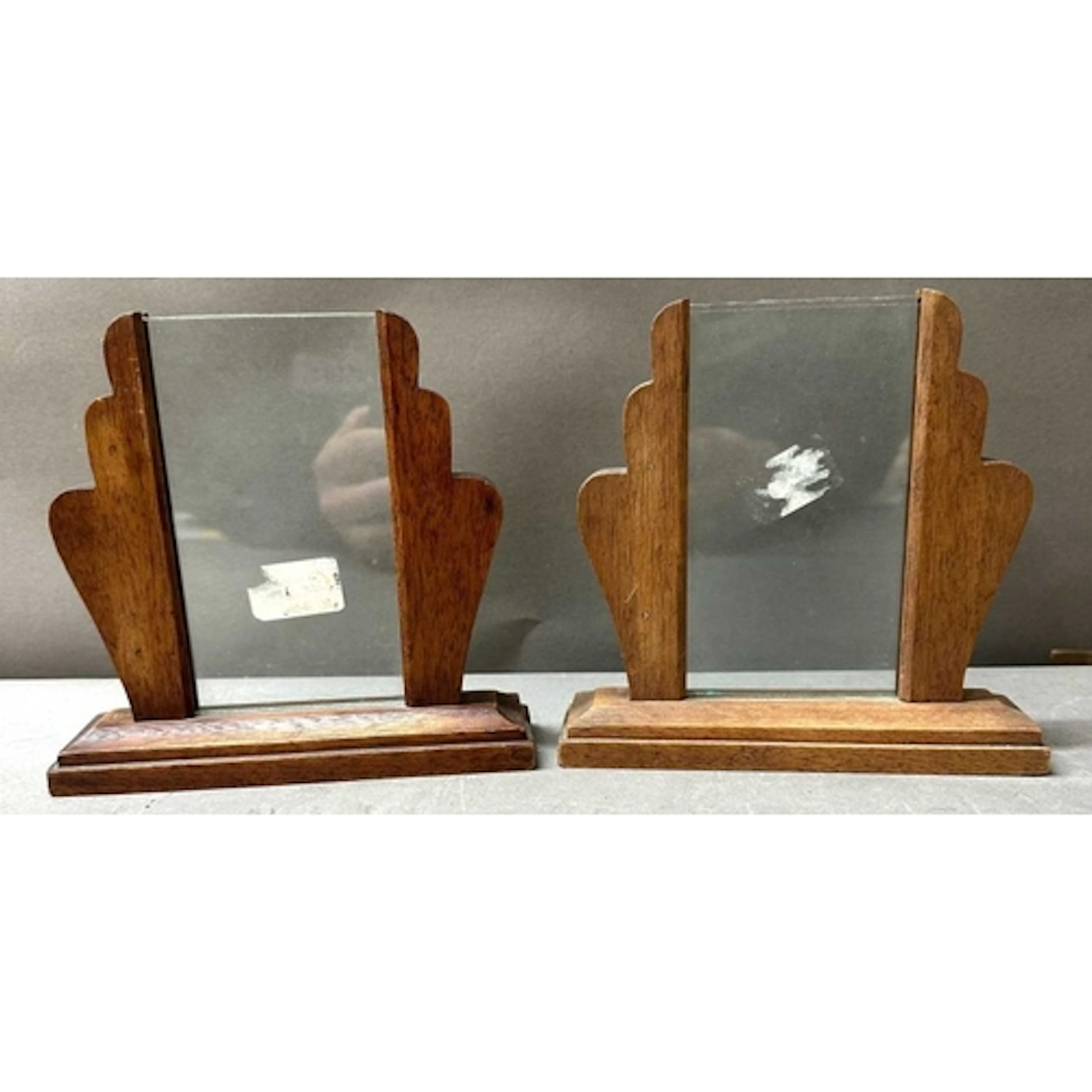 A pair of Art Deco photo frames with glass support glass pan...