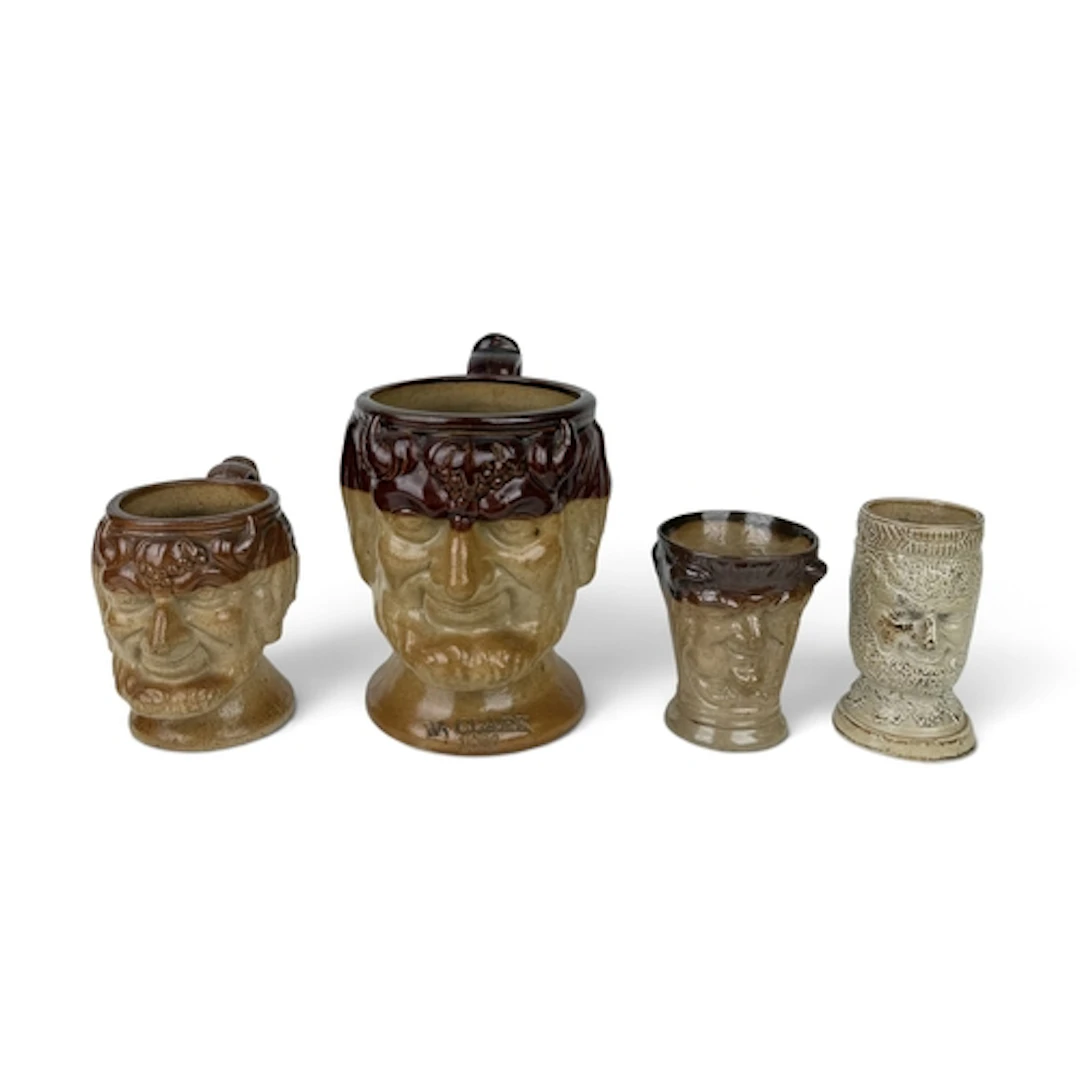 AN ENGLISH SALT-GLAZED STONEWARE BACCHUS MUG, 1890 Impressed...
