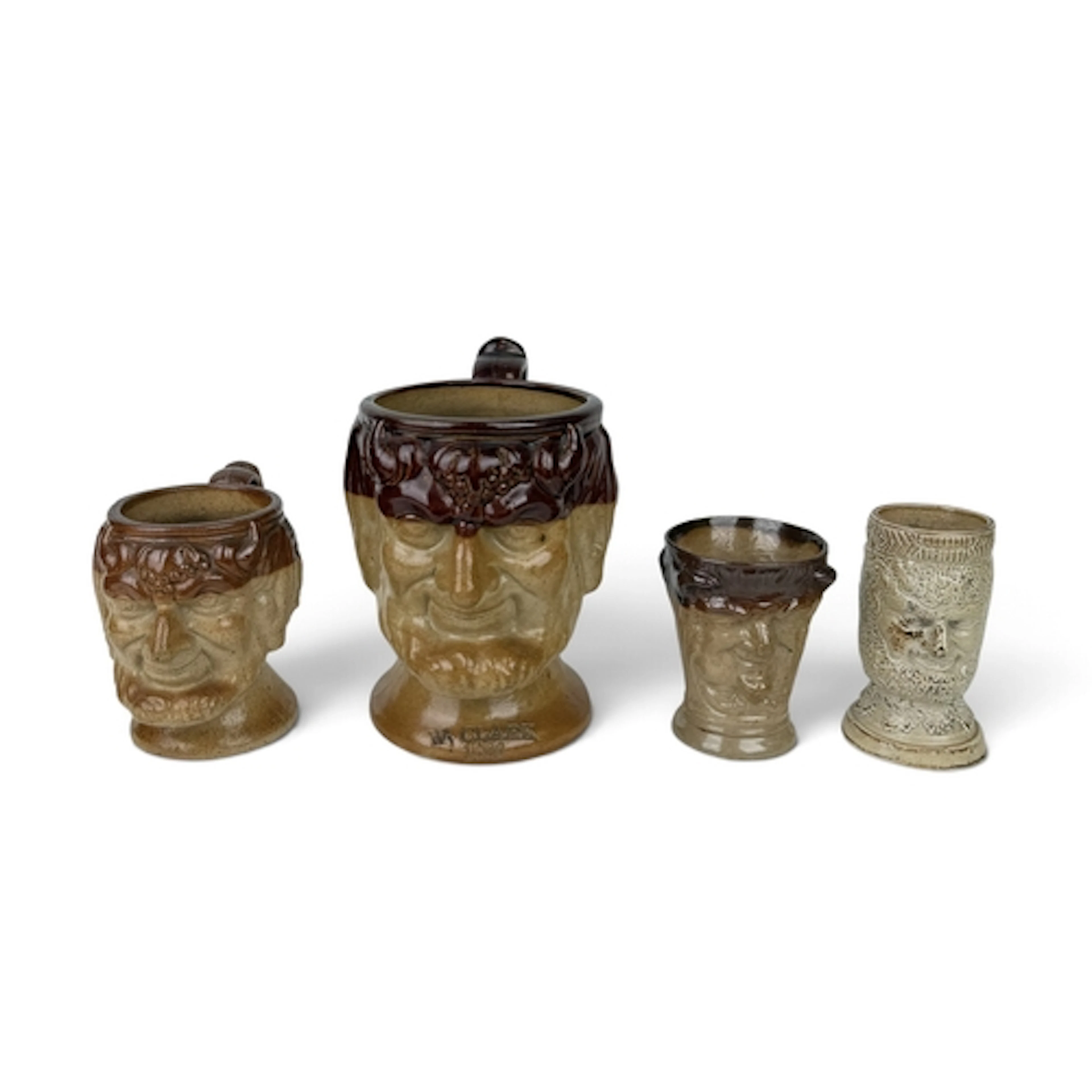 AN ENGLISH SALT-GLAZED STONEWARE BACCHUS MUG, 1890 Impressed...