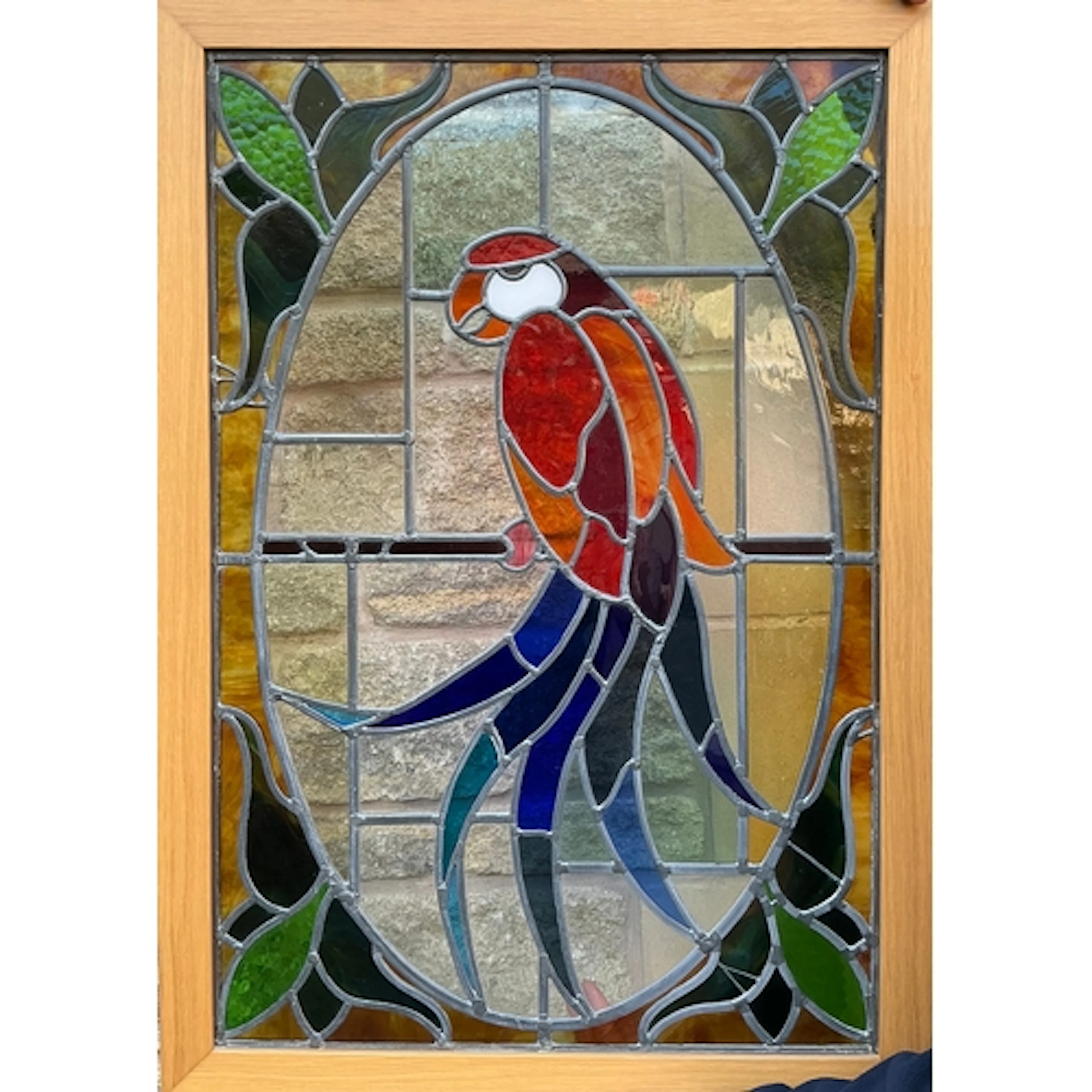 A 20th century stained glass panel featuring a red and blue ...