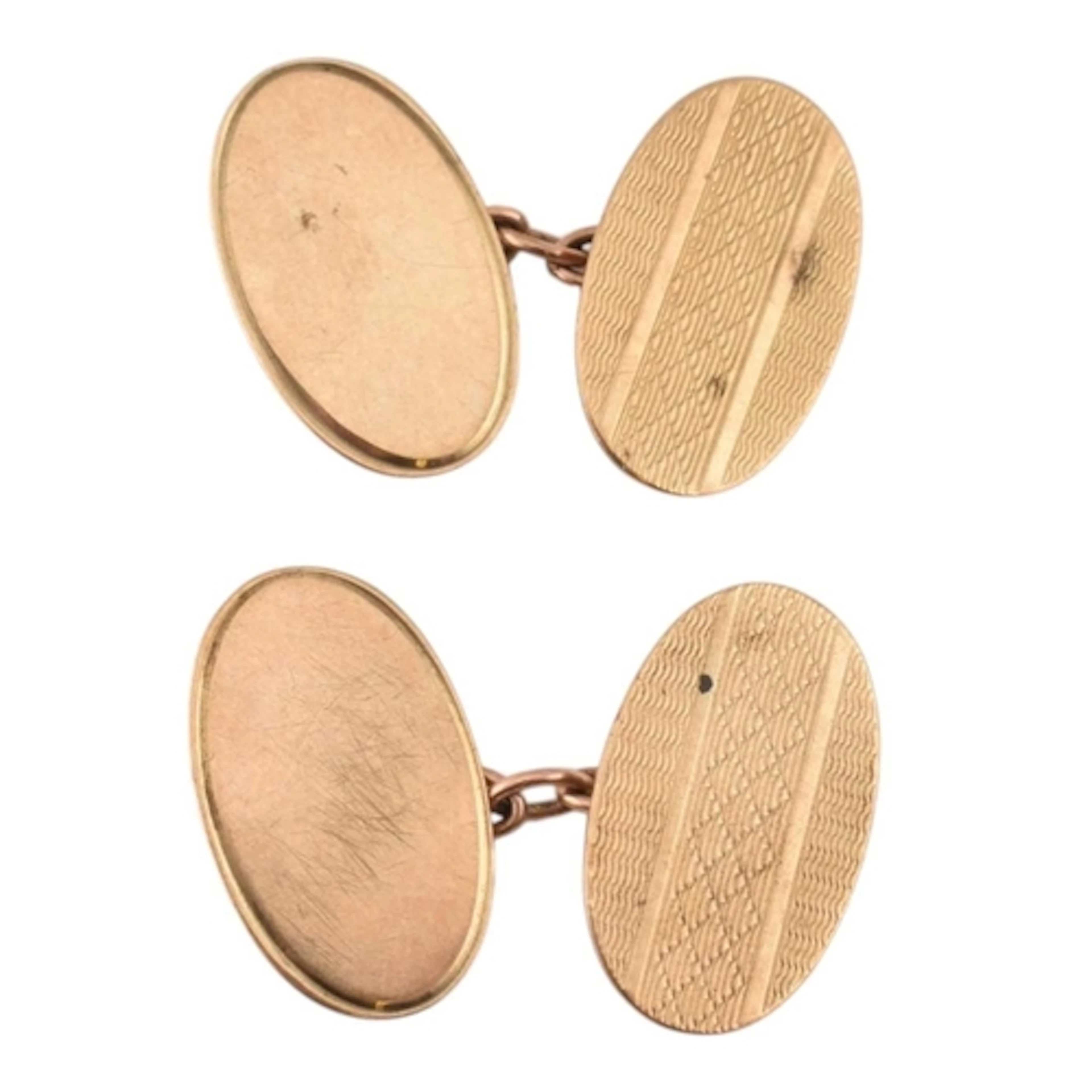 A pair of 1980s hallmarked 9ct gold oval cufflinks with etch...