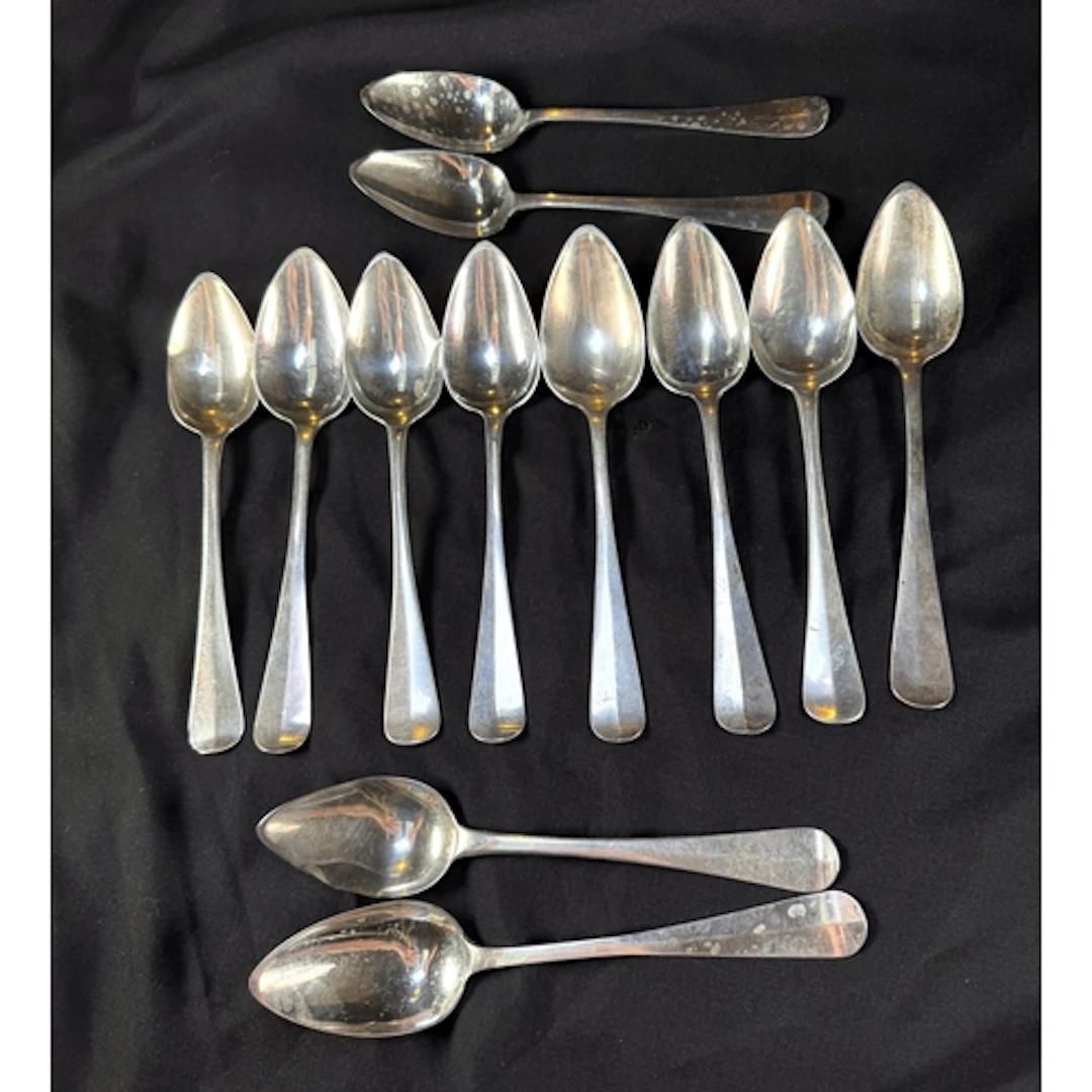 A matched set of 12 19th century Dutch silver table sp...