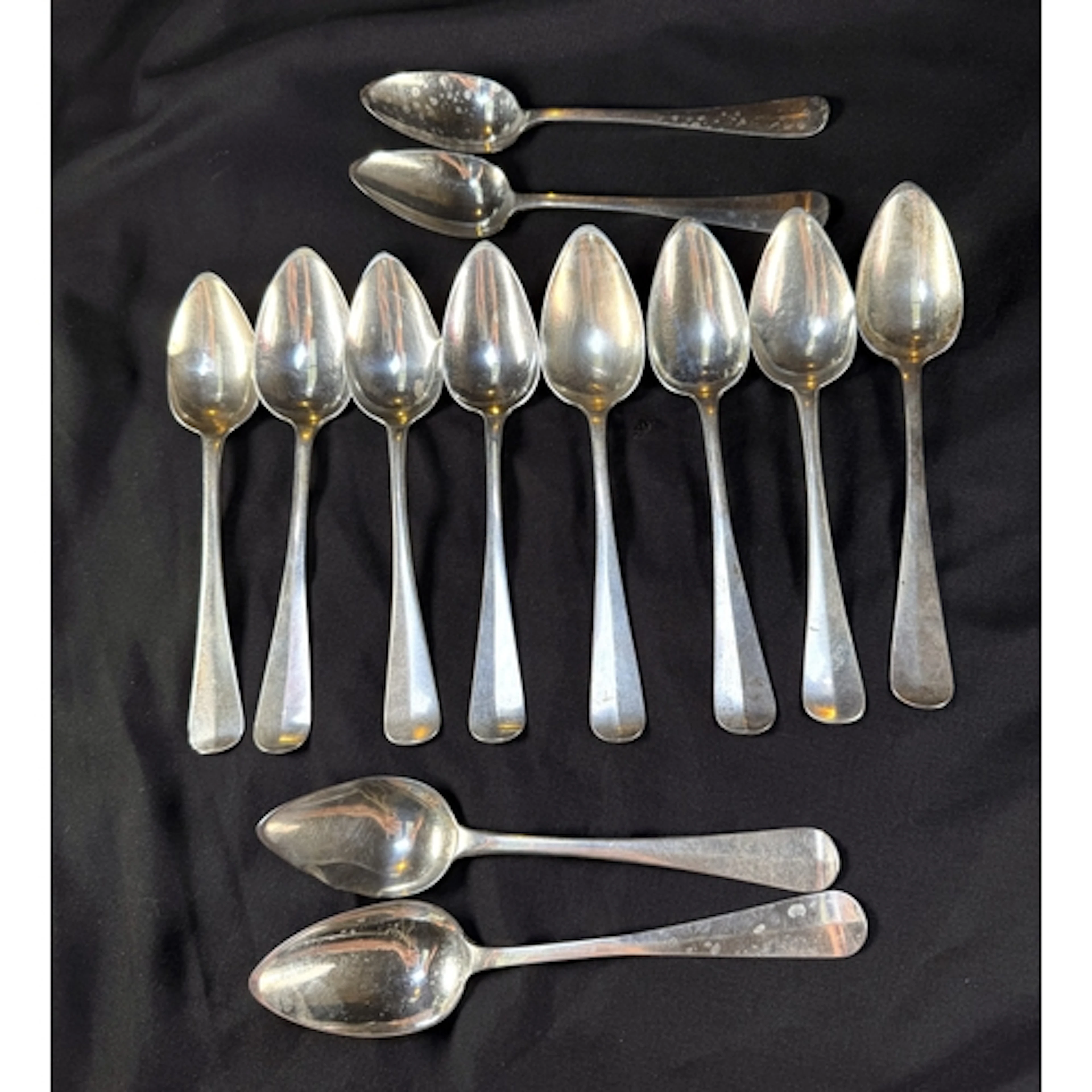 A matched set of 12 19th century Dutch silver table sp...